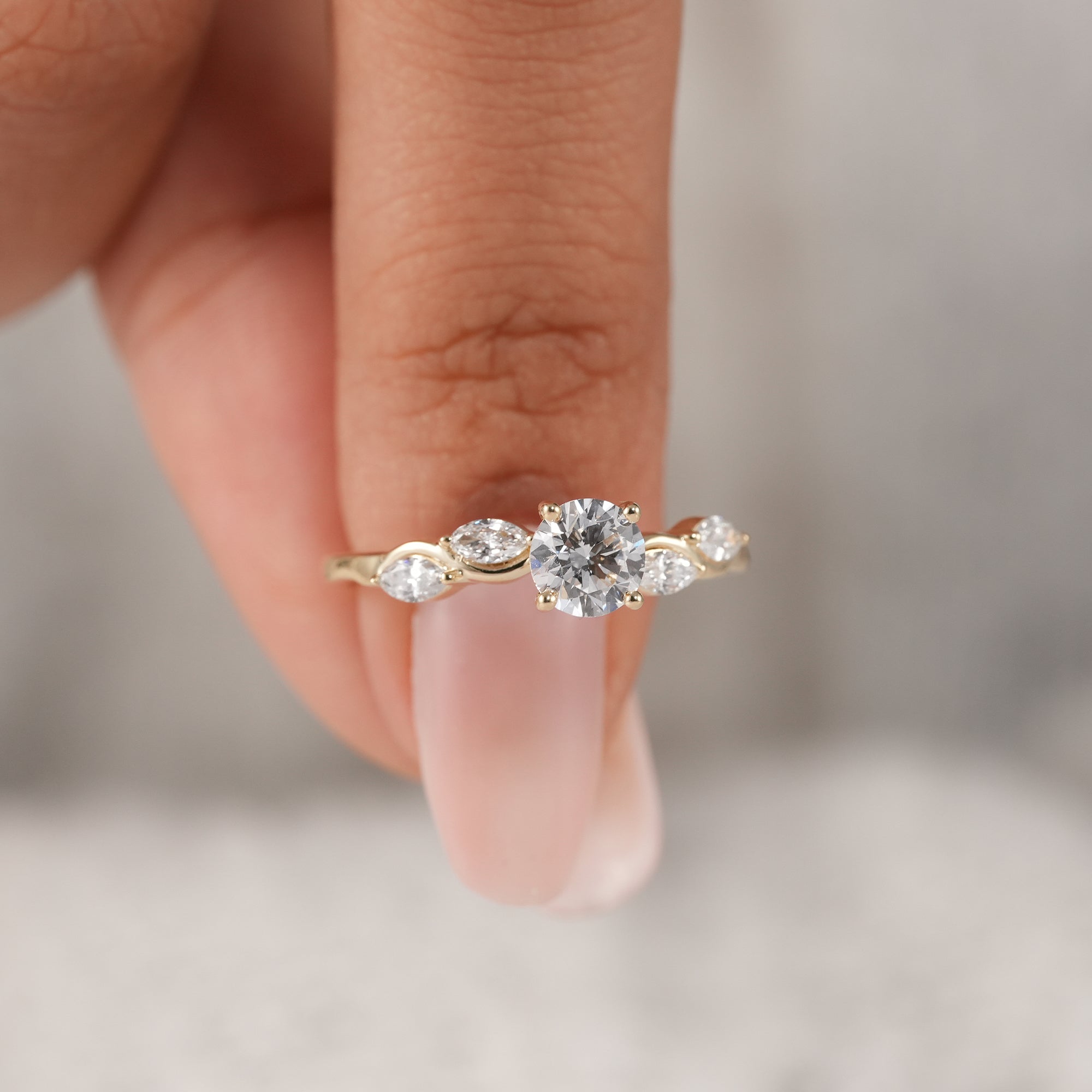 Elegant bridal ring with round center diamond and wave band.