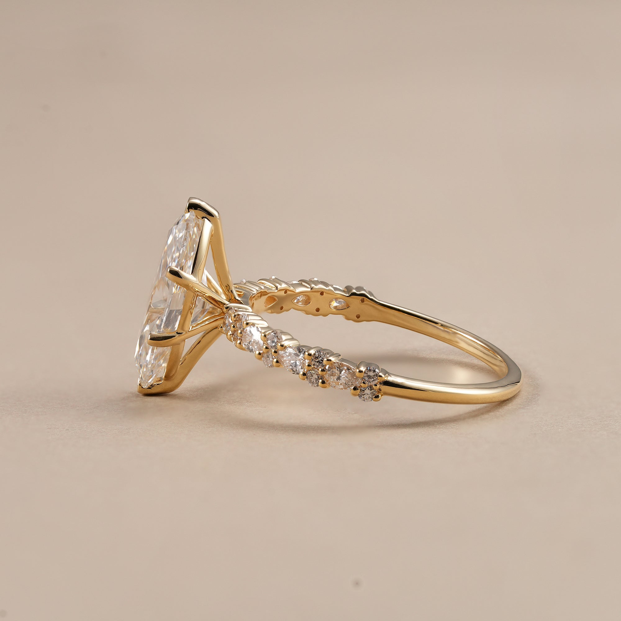 Elegant marquise bridal ring with round and pear diamonds
