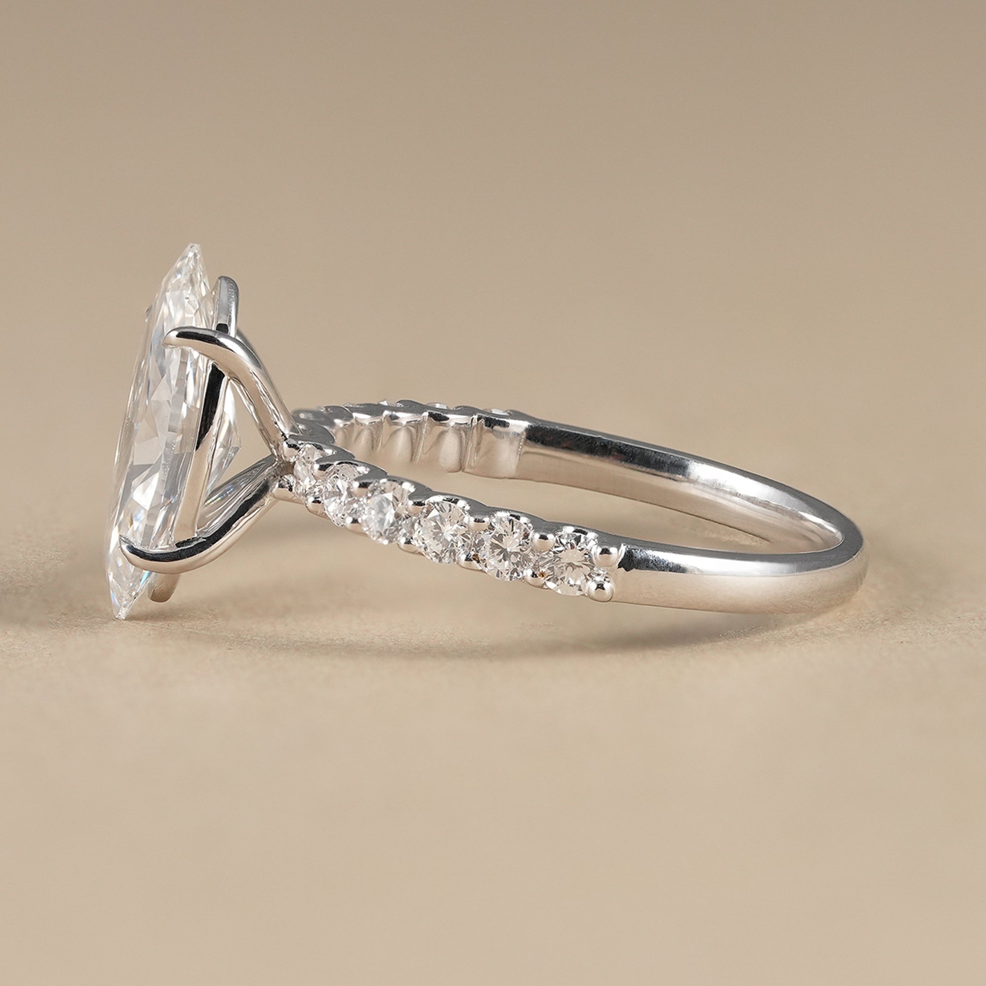 Elegant marquise cut engagement ring with round diamonds