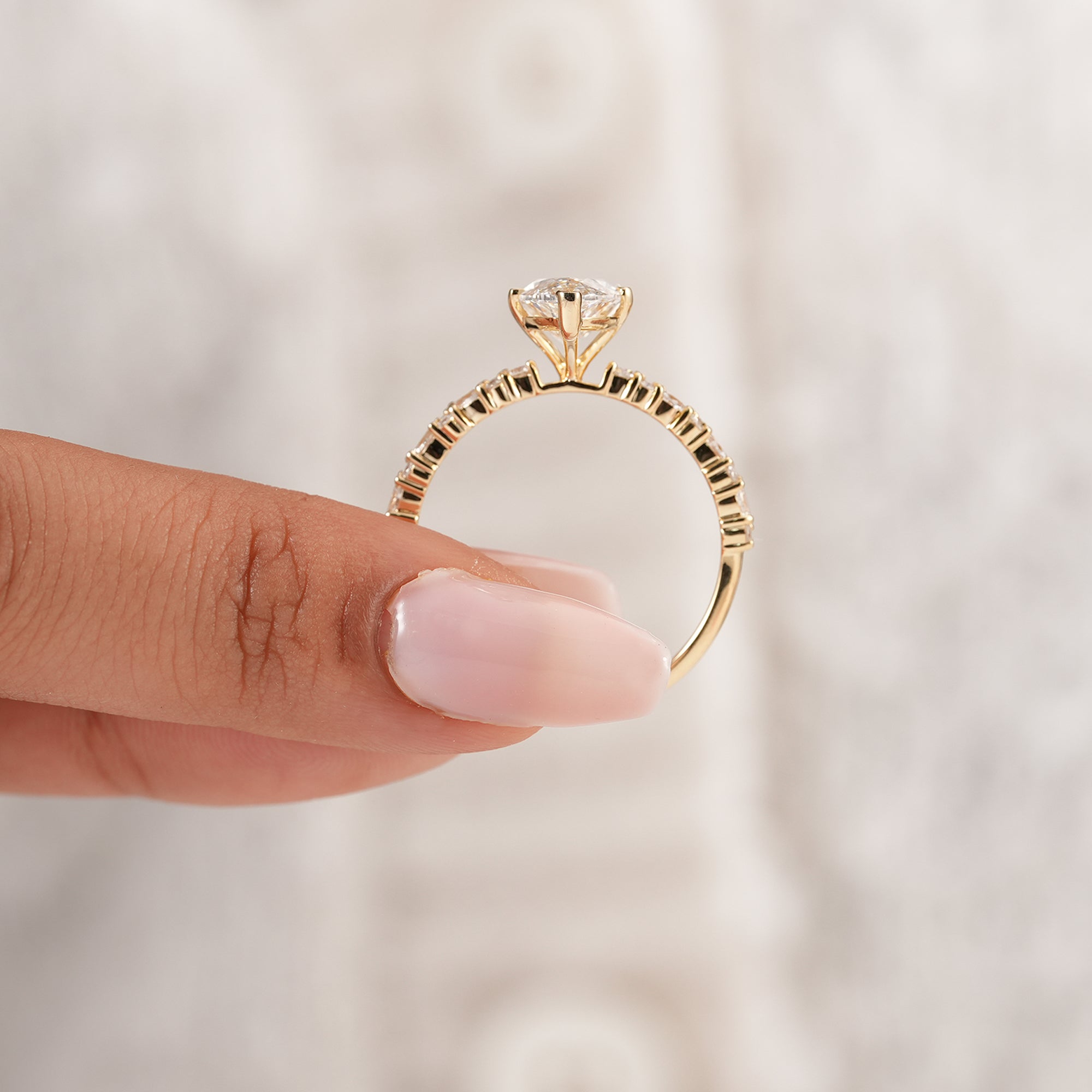 Unique marquise bridal engagement ring with accent diamonds