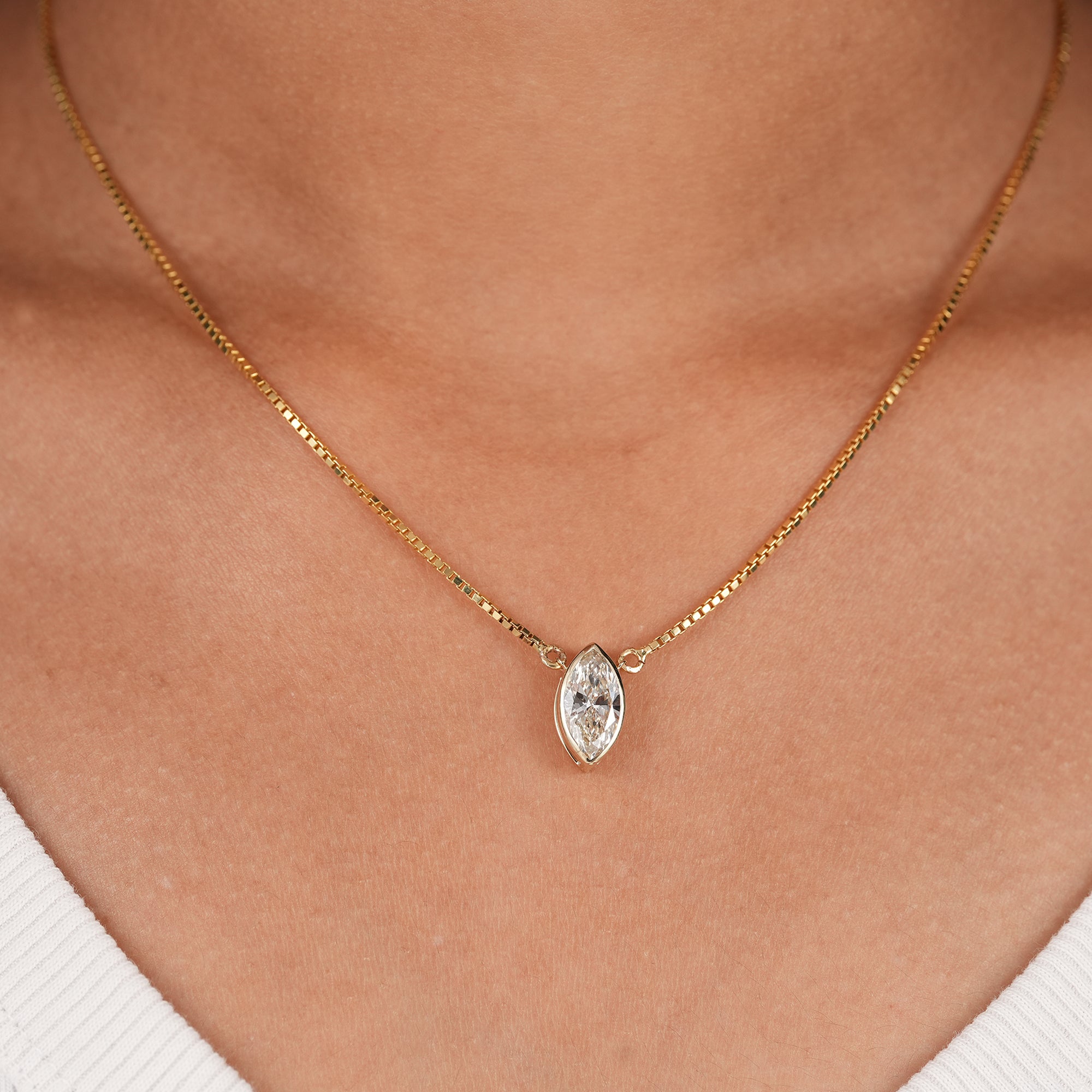Marquise lab grown diamond bezel pendant necklace in solid gold