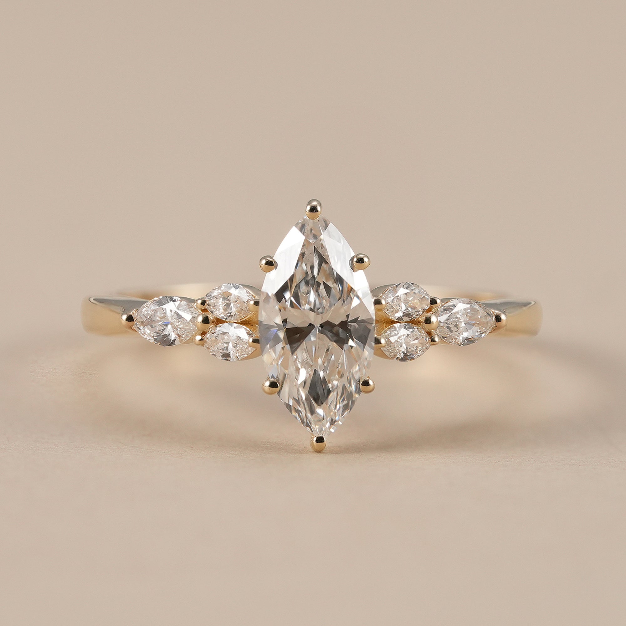 Marquise lab grown diamond engagement ring with marquise cluster accents