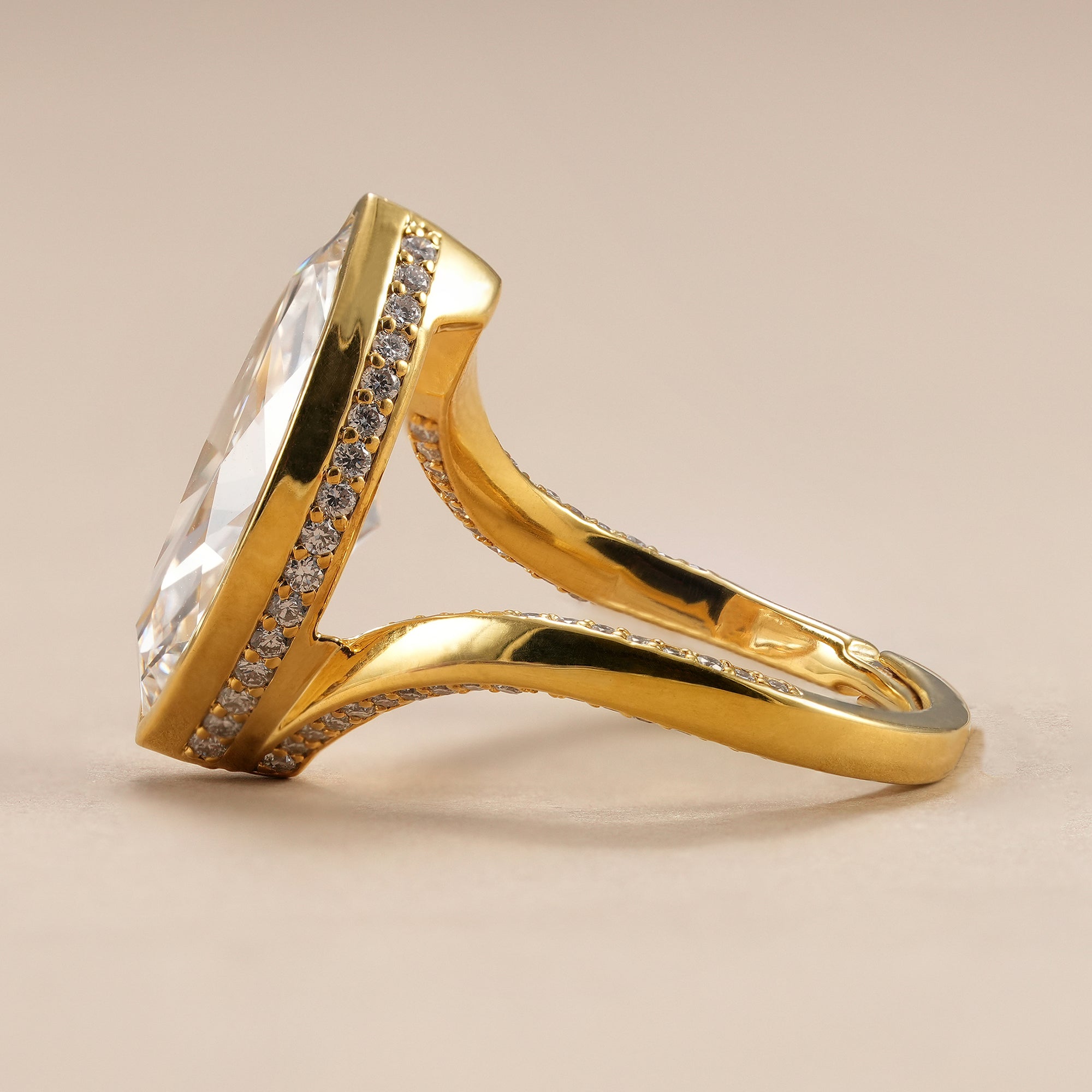 Modern bezel set marquise solitaire engagement ring for women.