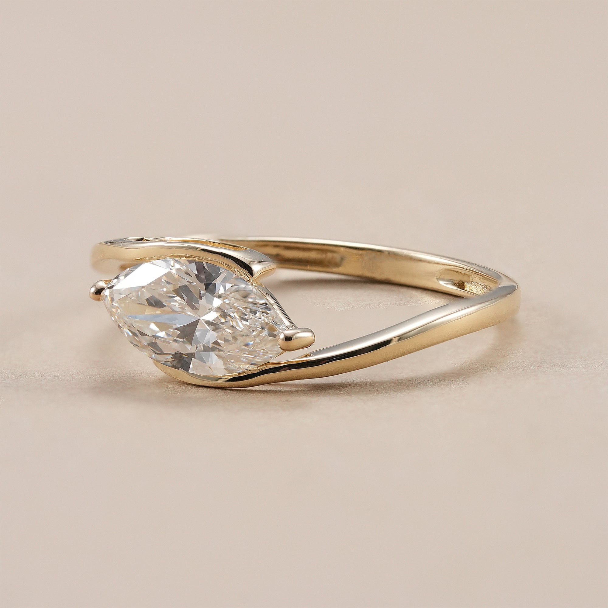 Elegant marquise diamond bypass ring for women.