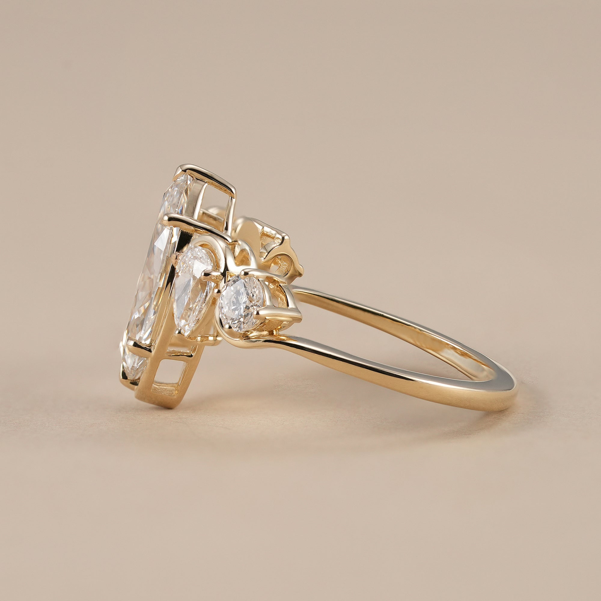 Pear and round accent diamond statement ring