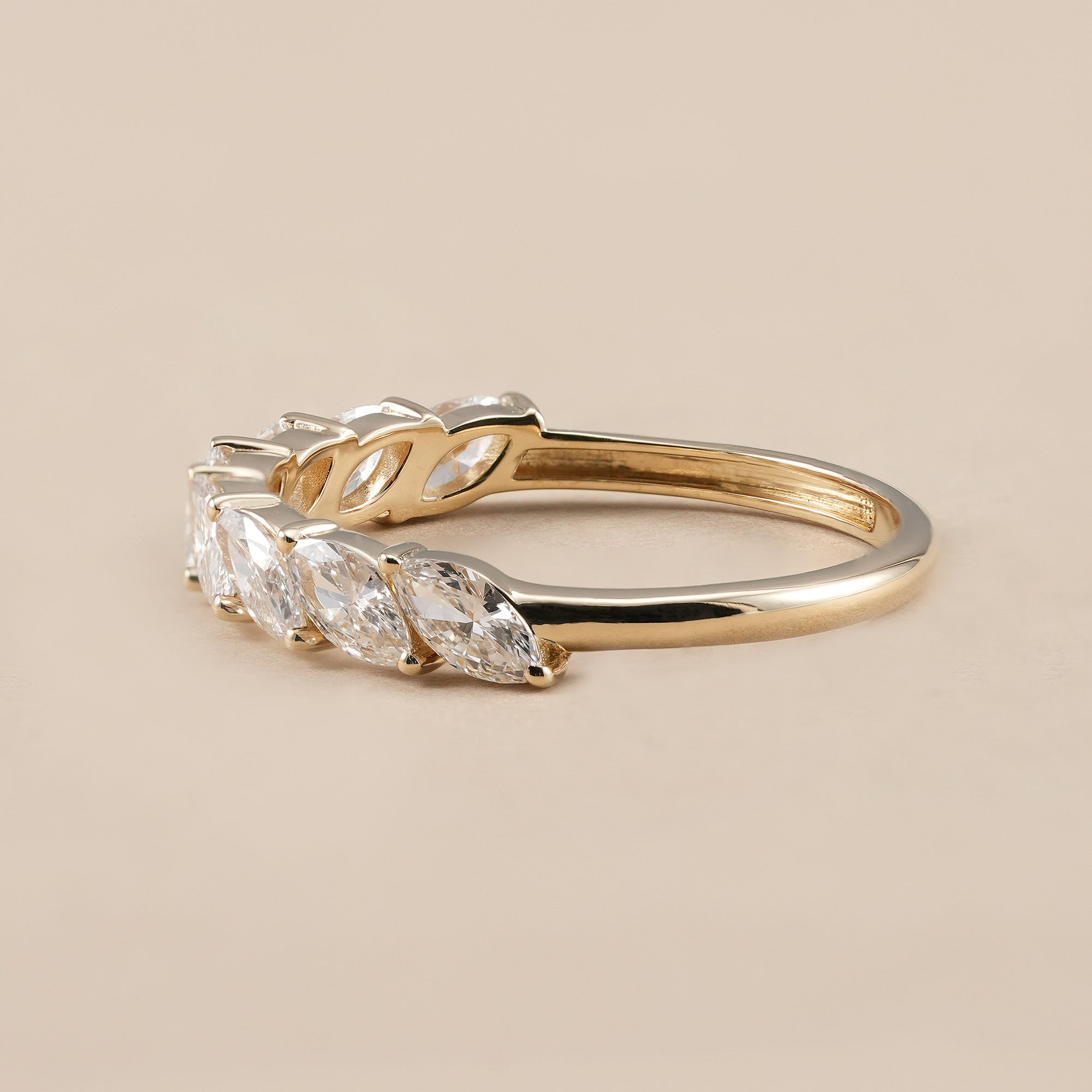 Marquise wedding band with shared prong diamonds