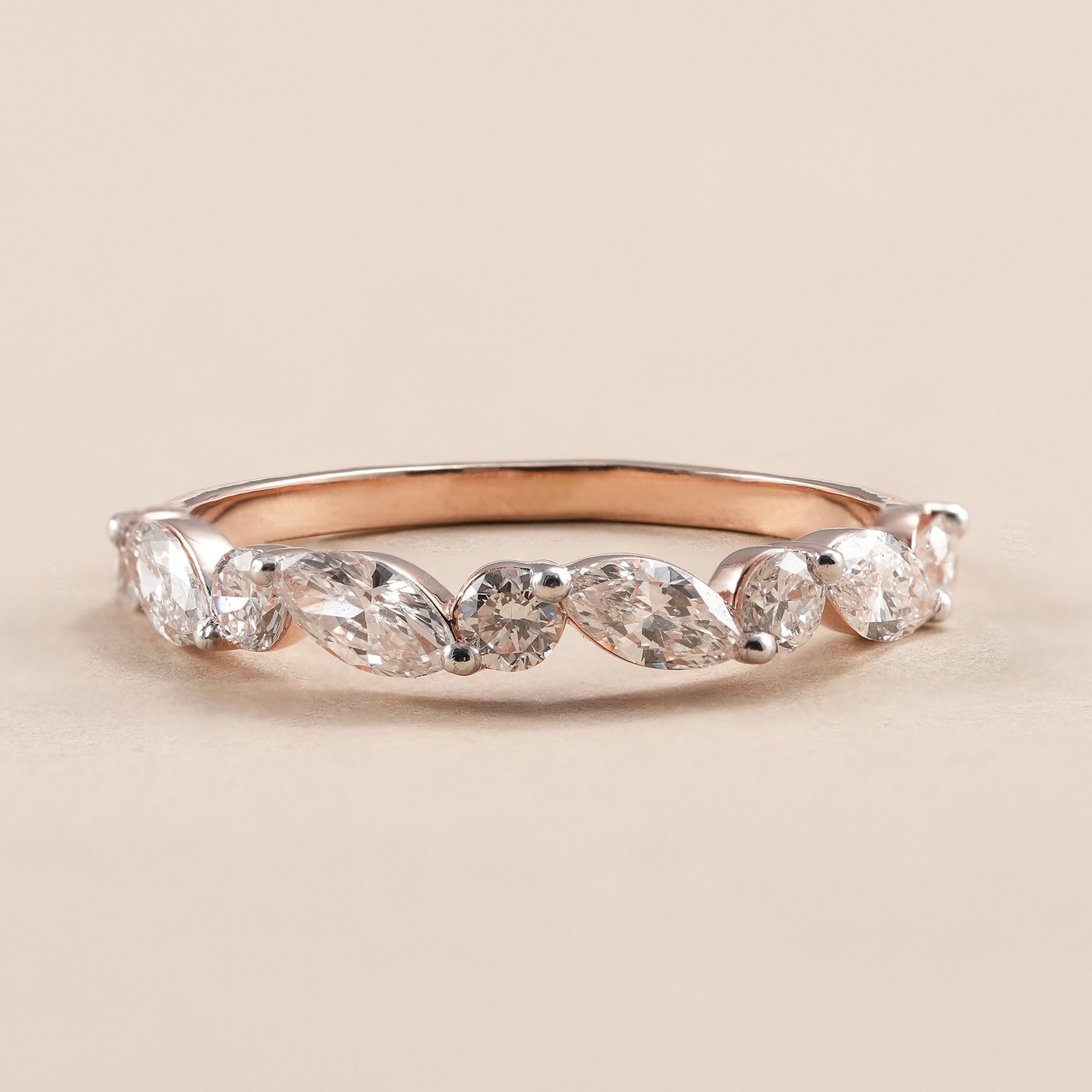 Marquise and round lab diamond wedding band in rose gold.