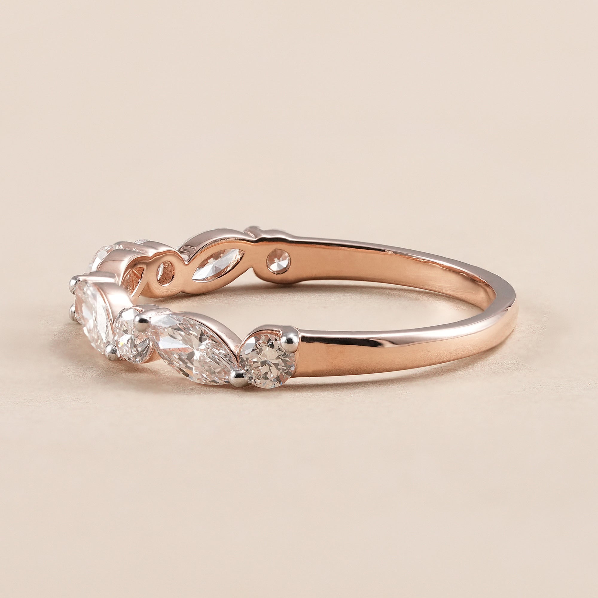 Alternating marquise and round diamond bridal band.
