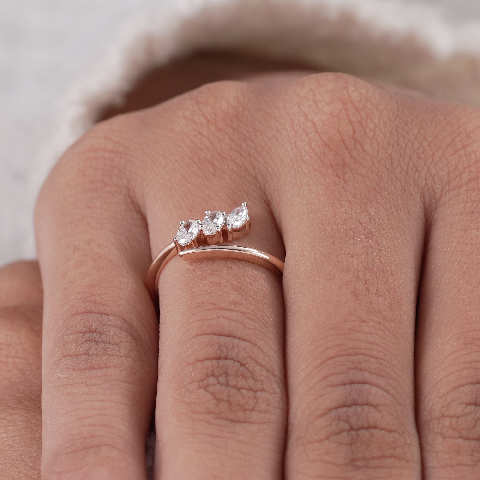 Open engagement style band with oval and marquise stones