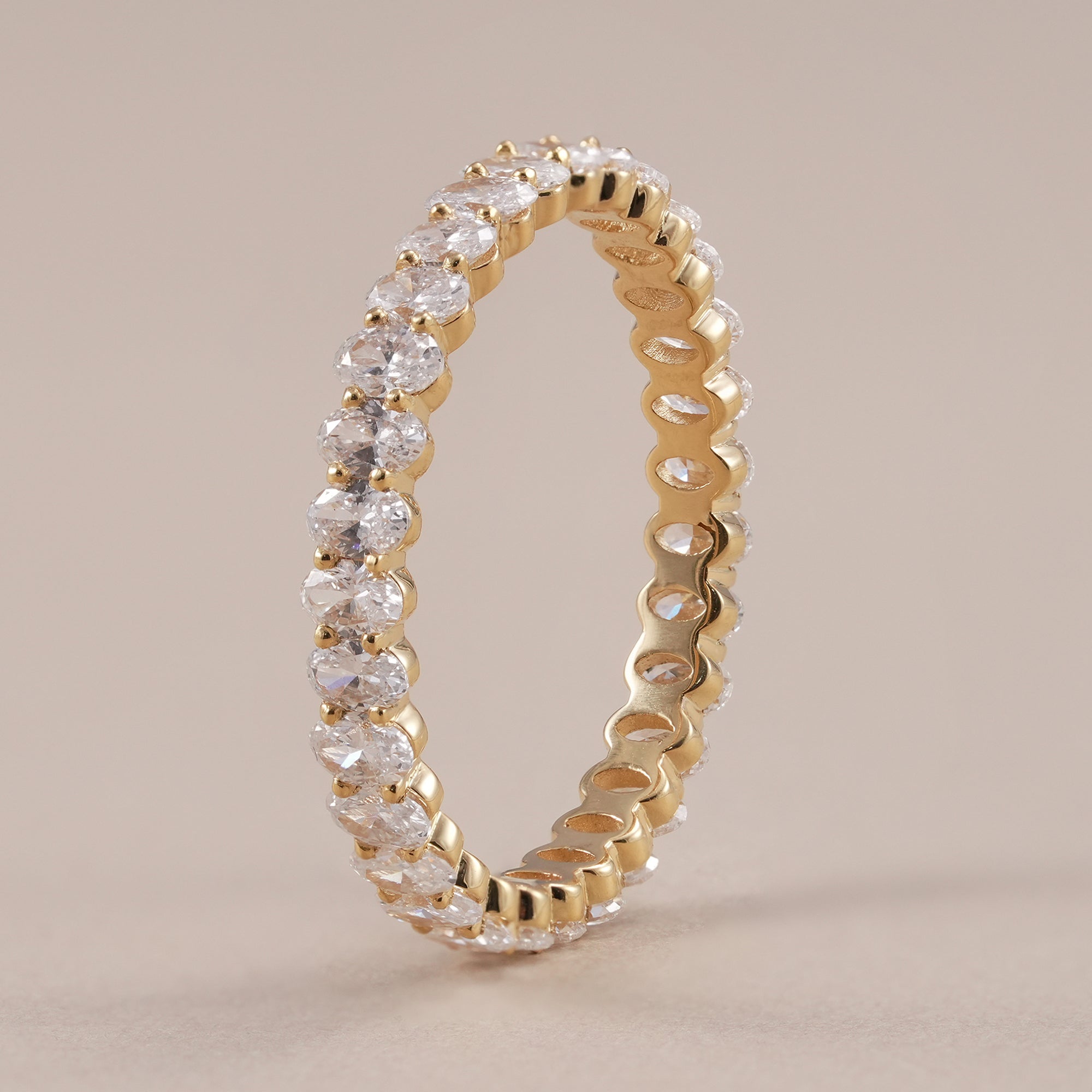 Minimalist oval diamond stacking wedding band for women.