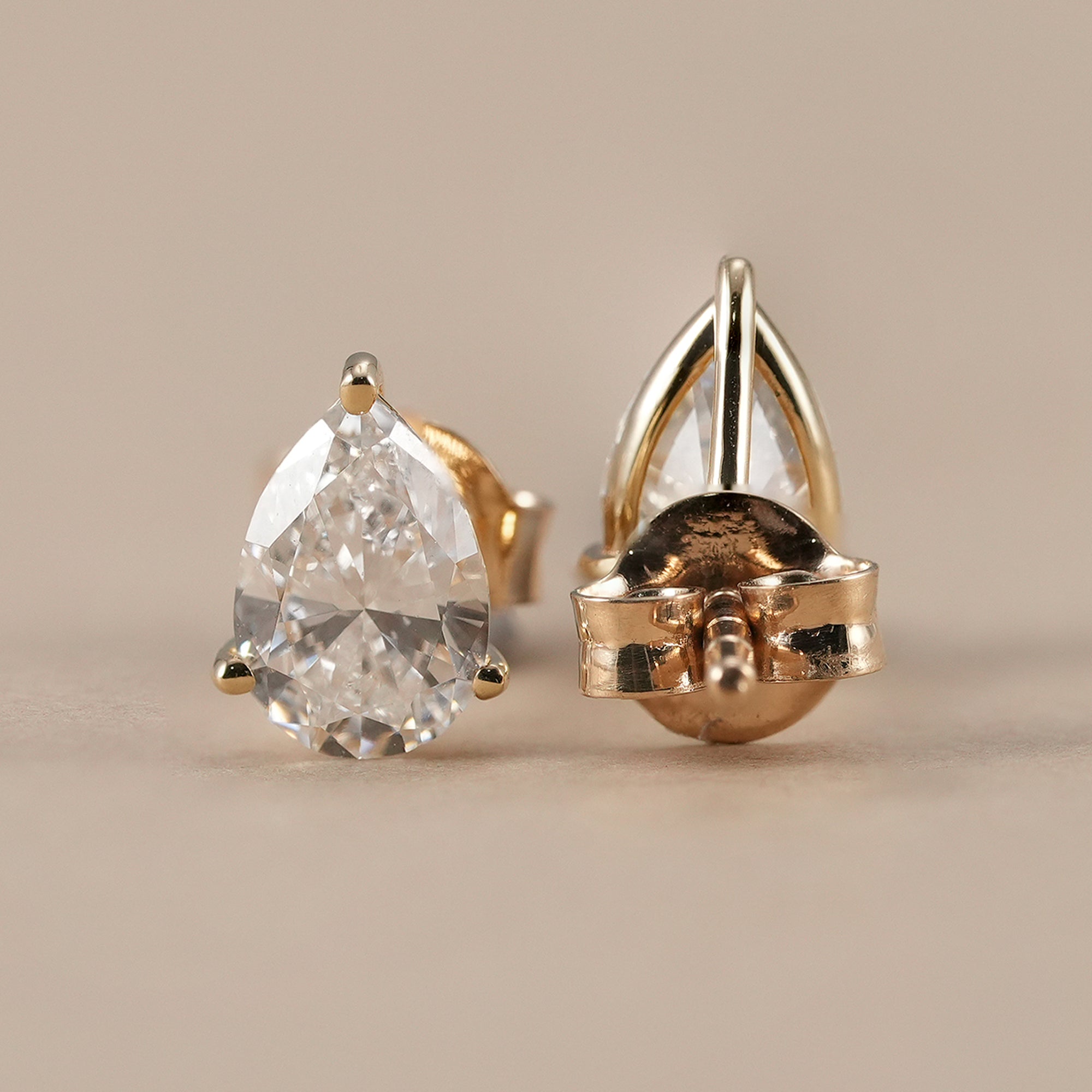 Minimalist pear diamond stud earrings for women