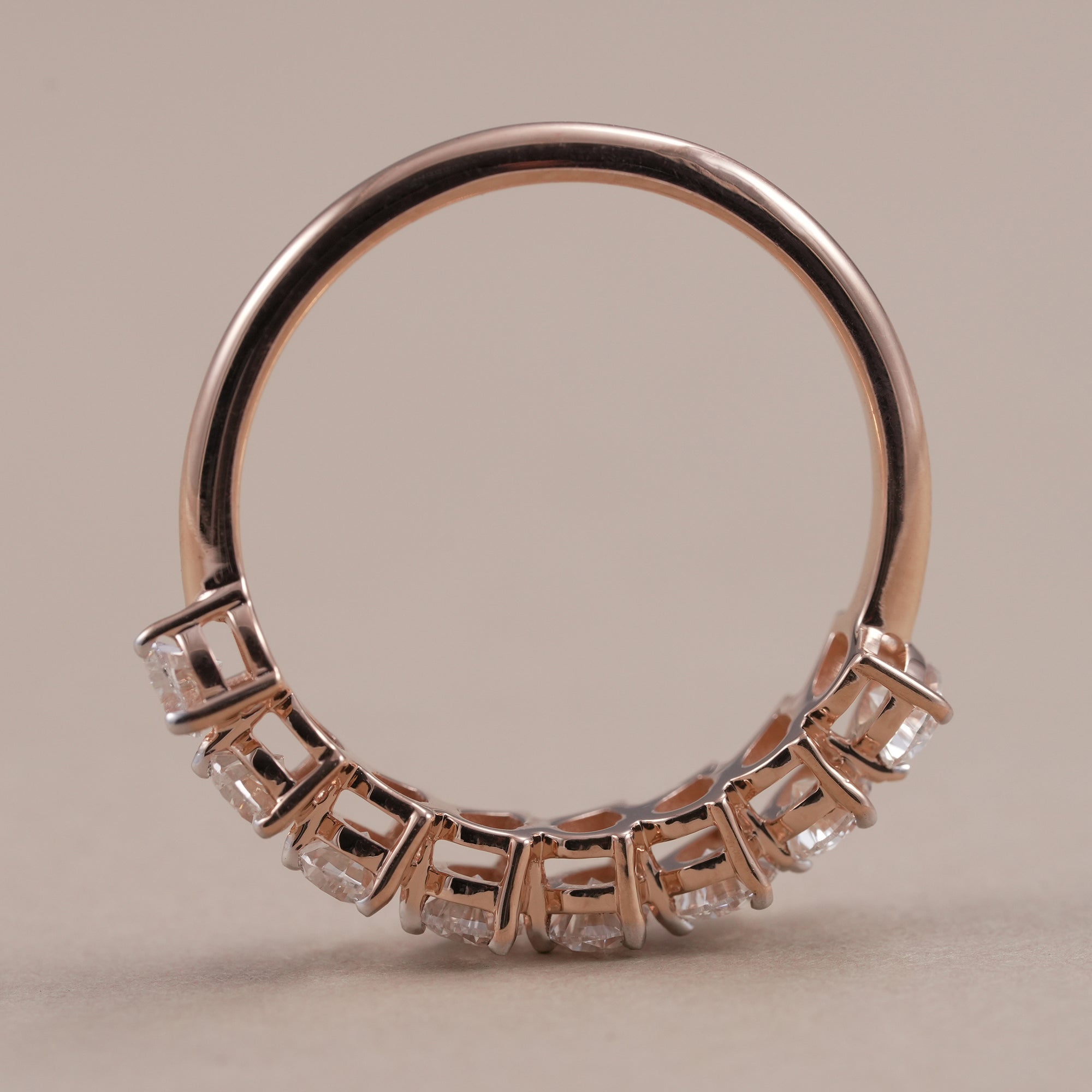 Half eternity wedding band featuring pear shaped diamonds