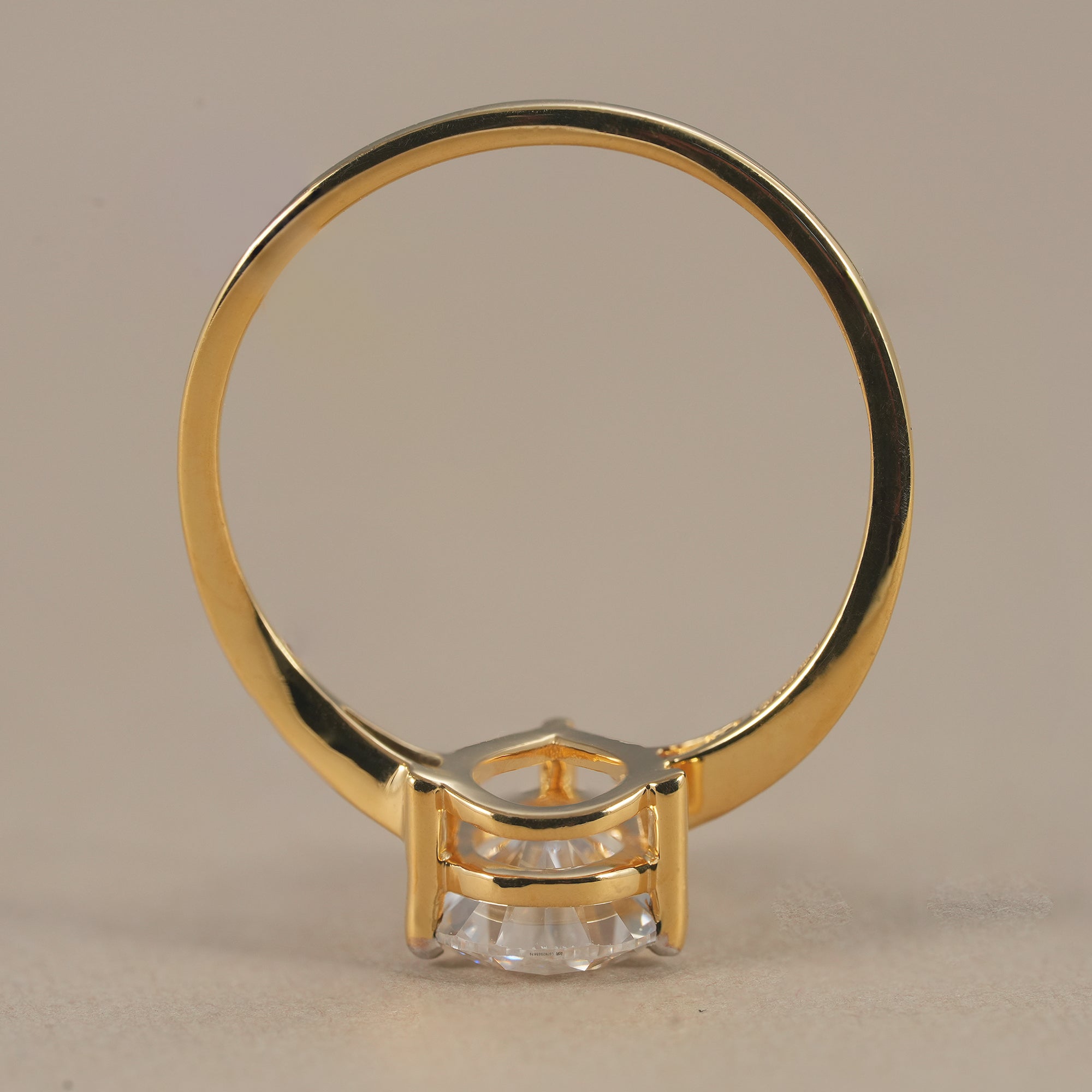 Twisted split band pear engagement ring in yellow gold