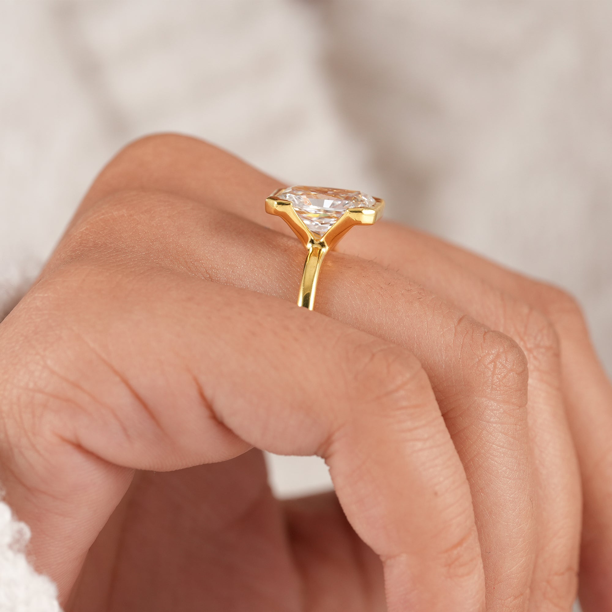 Contemporary bezel set radiant lab diamond ring for women.