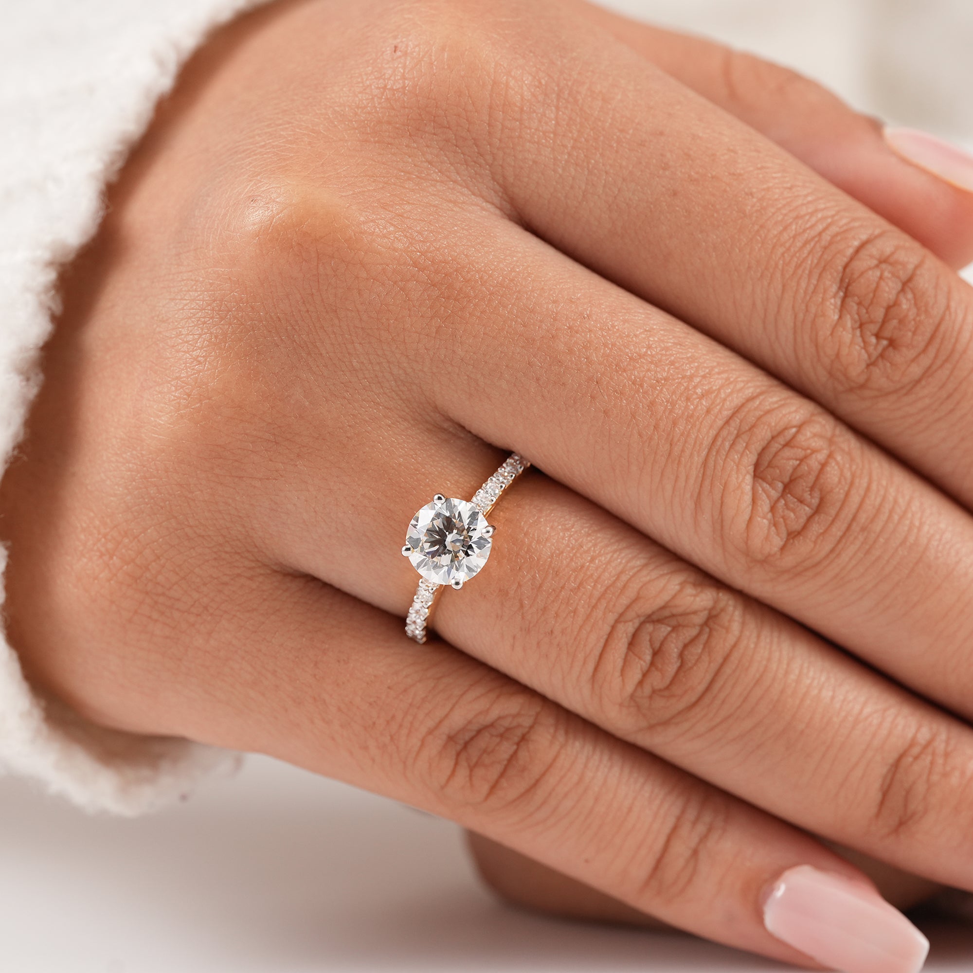 Round diamond proposal ring with delicate pavé band