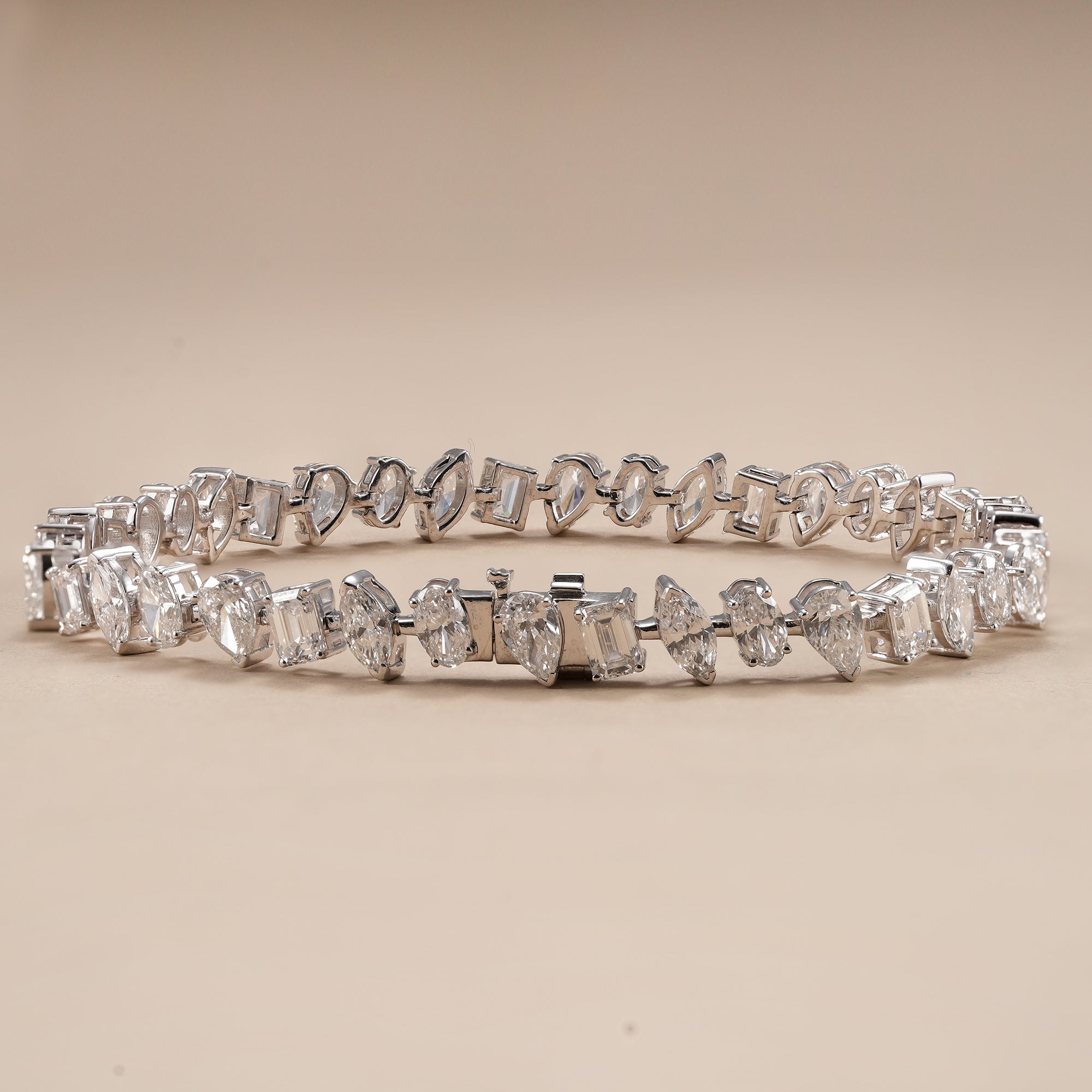 Fine jewelry lab diamond bracelet with alternating diamond shapes.