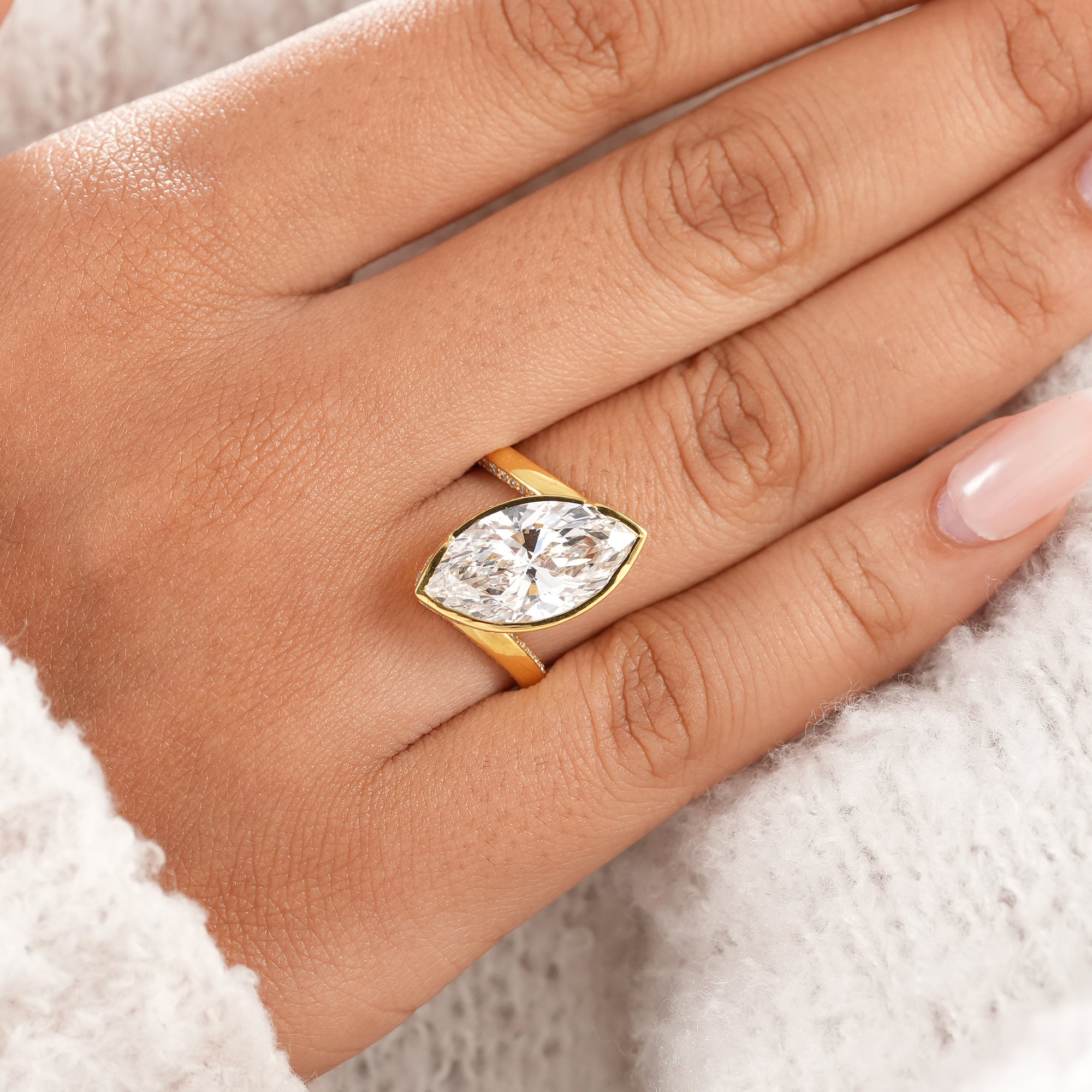 Handmade marquise lab grown diamond bridal ring in solid gold.