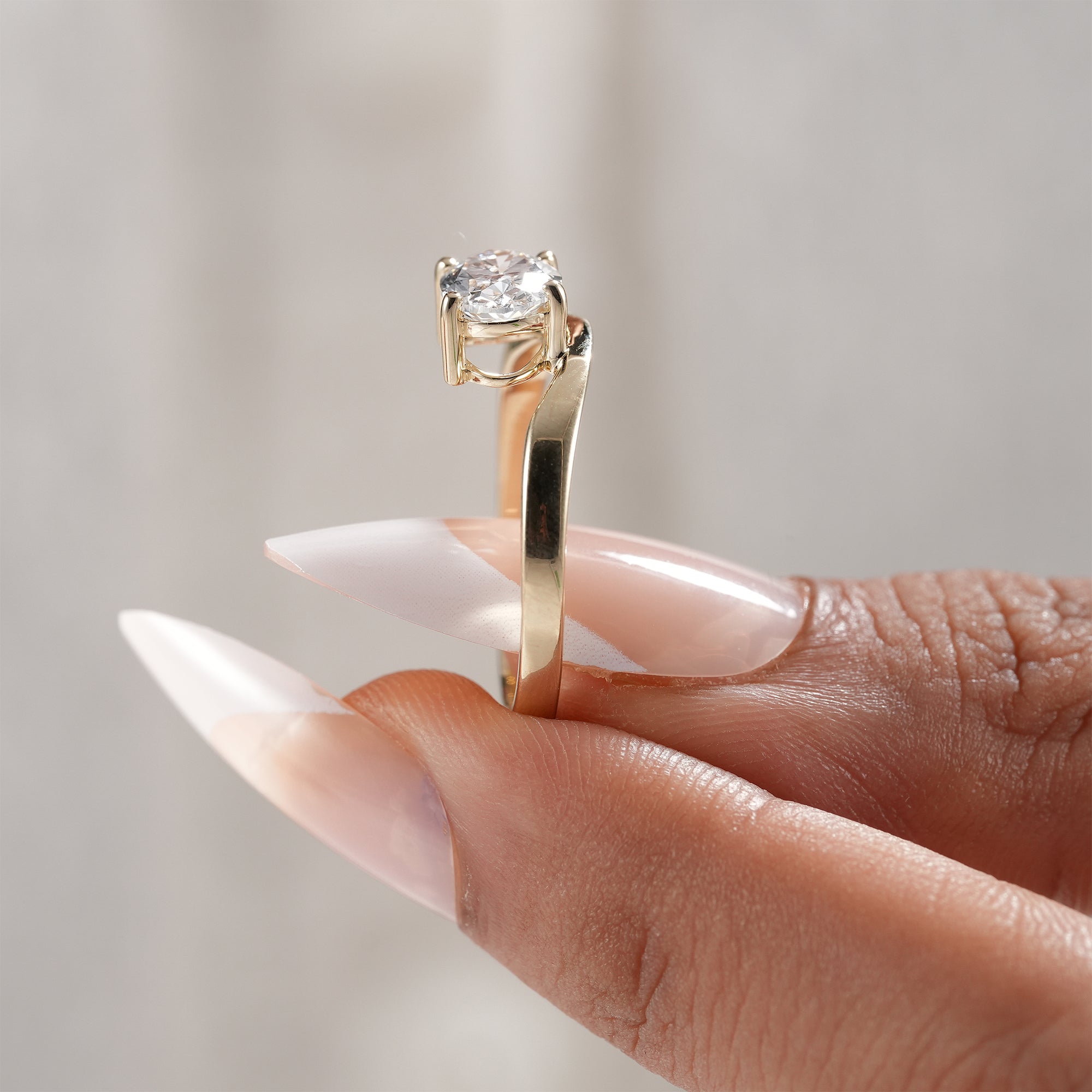 Handcrafted oval lab diamond engagement ring.