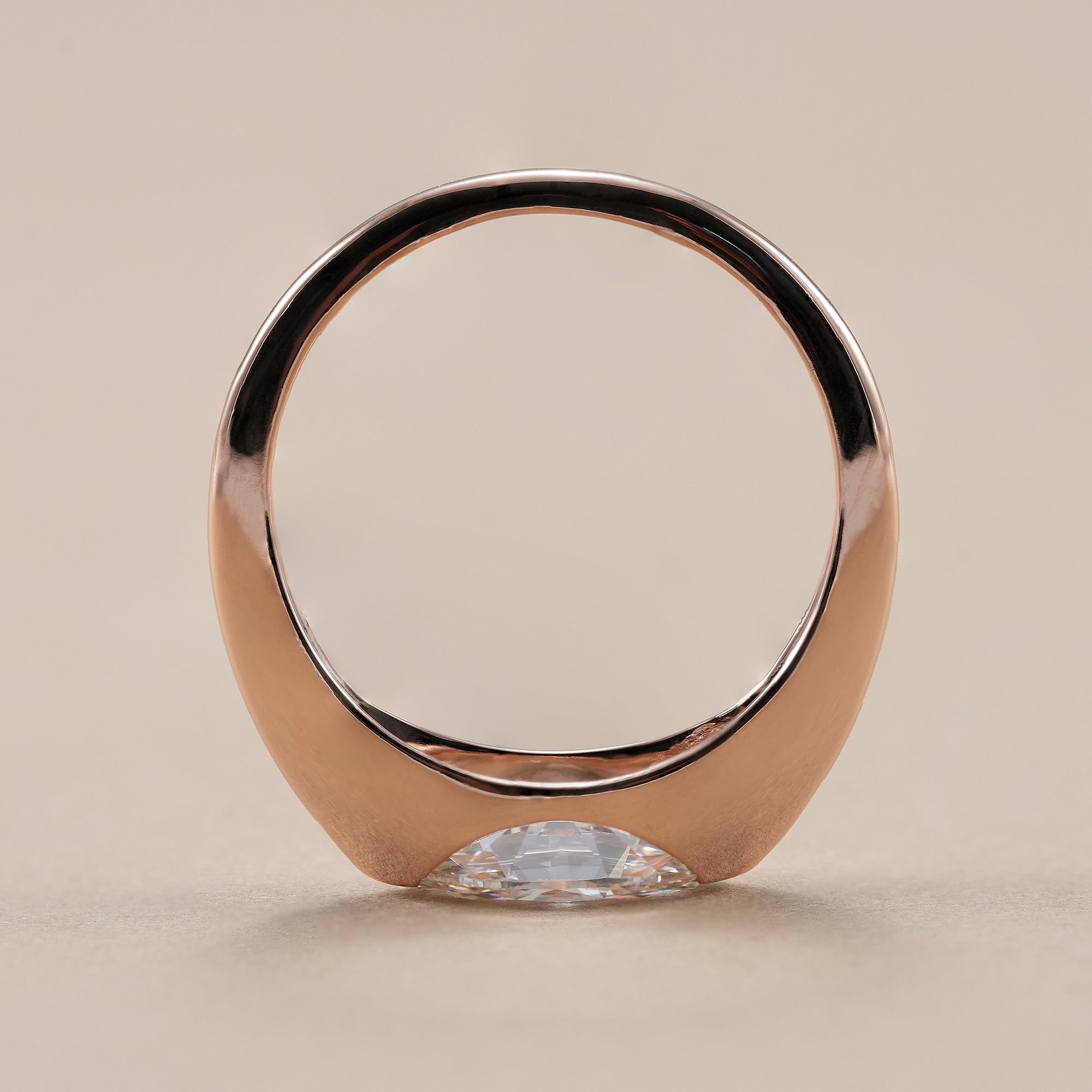 Elegant marquise diamond ring with minimalist band.