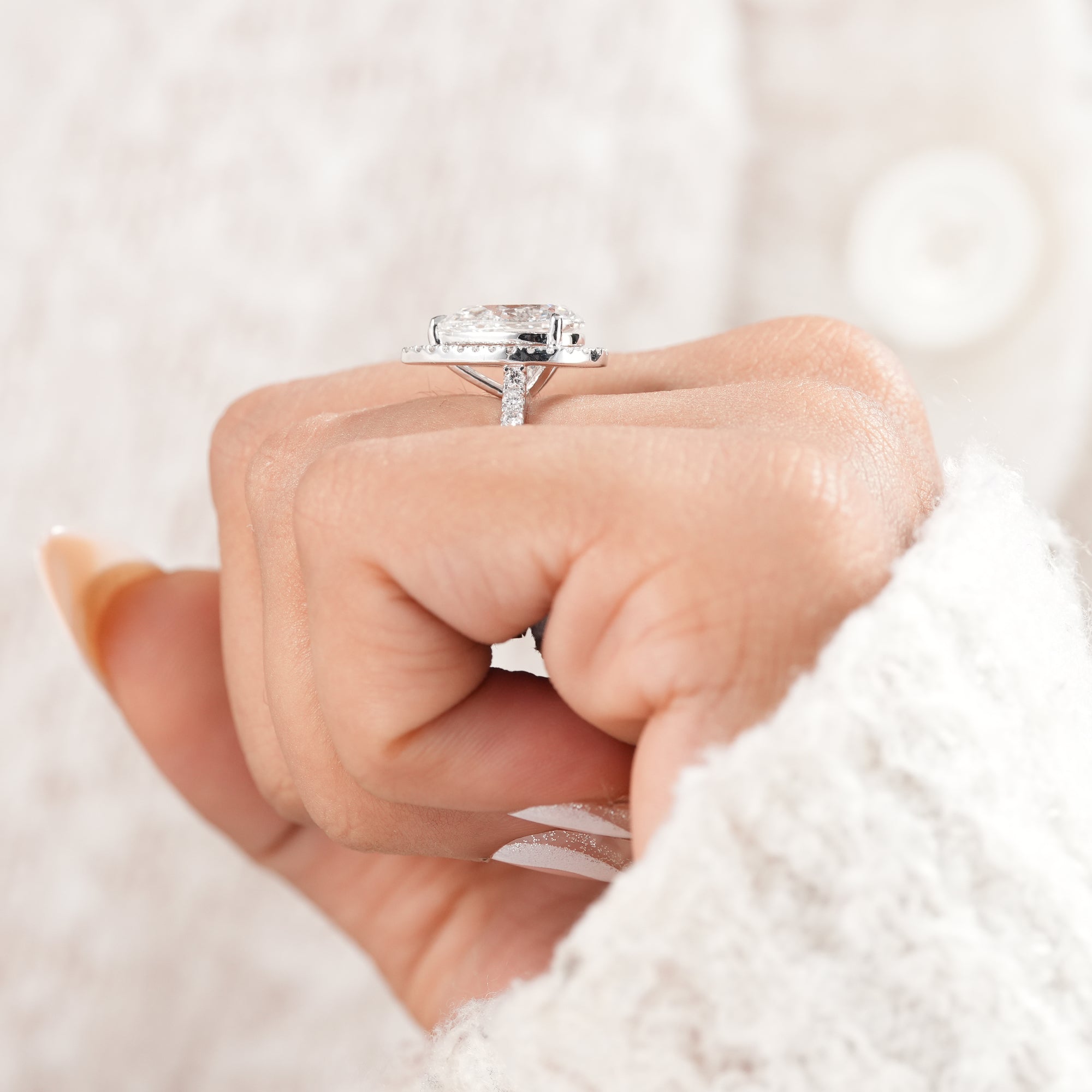 High polish pear lab diamond engagement ring.