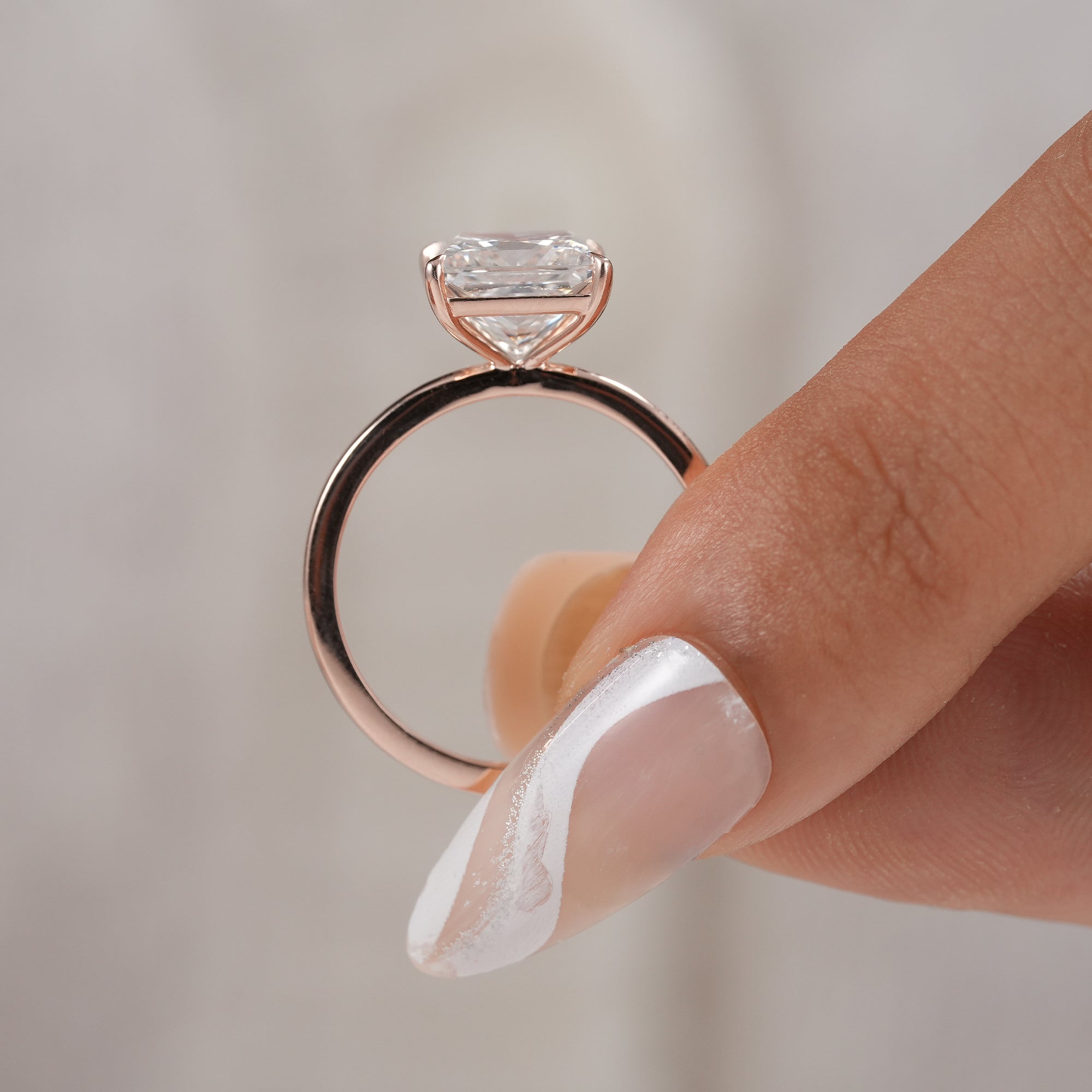 Rose gold princess engagement ring for modern brides.