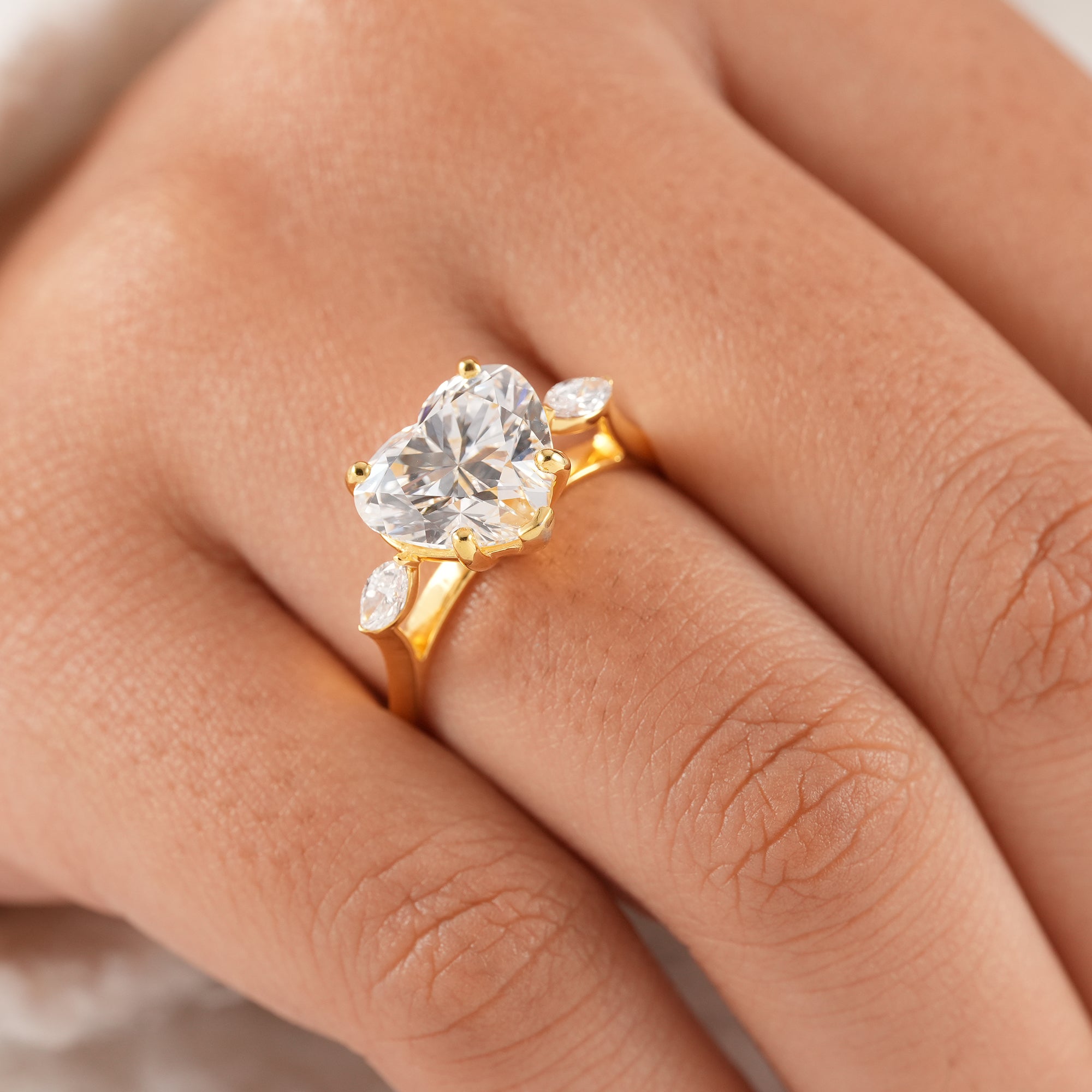High brilliance heart diamond ring with IGI certified center stone.