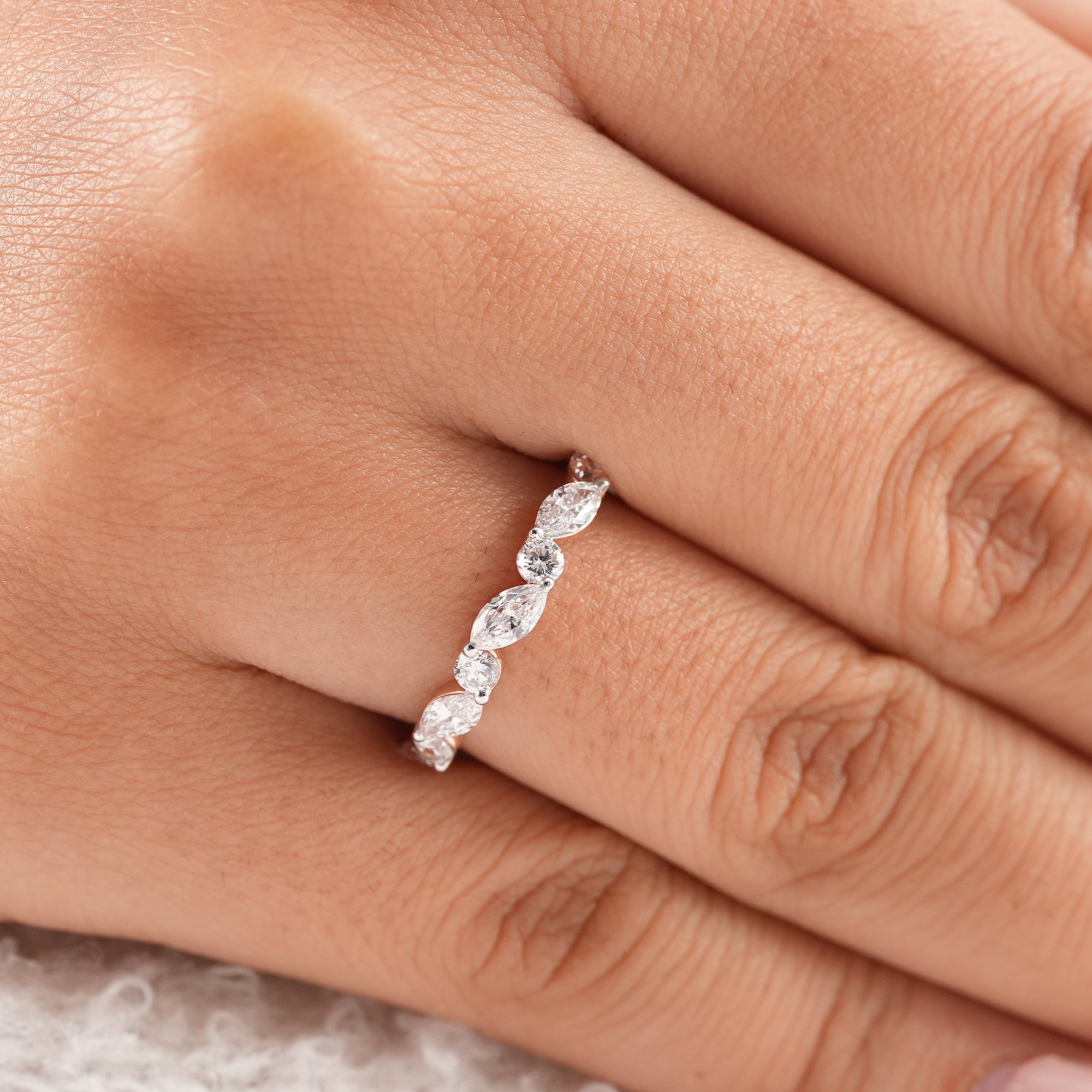 Rose gold stackable bridal ring with lab grown diamonds.