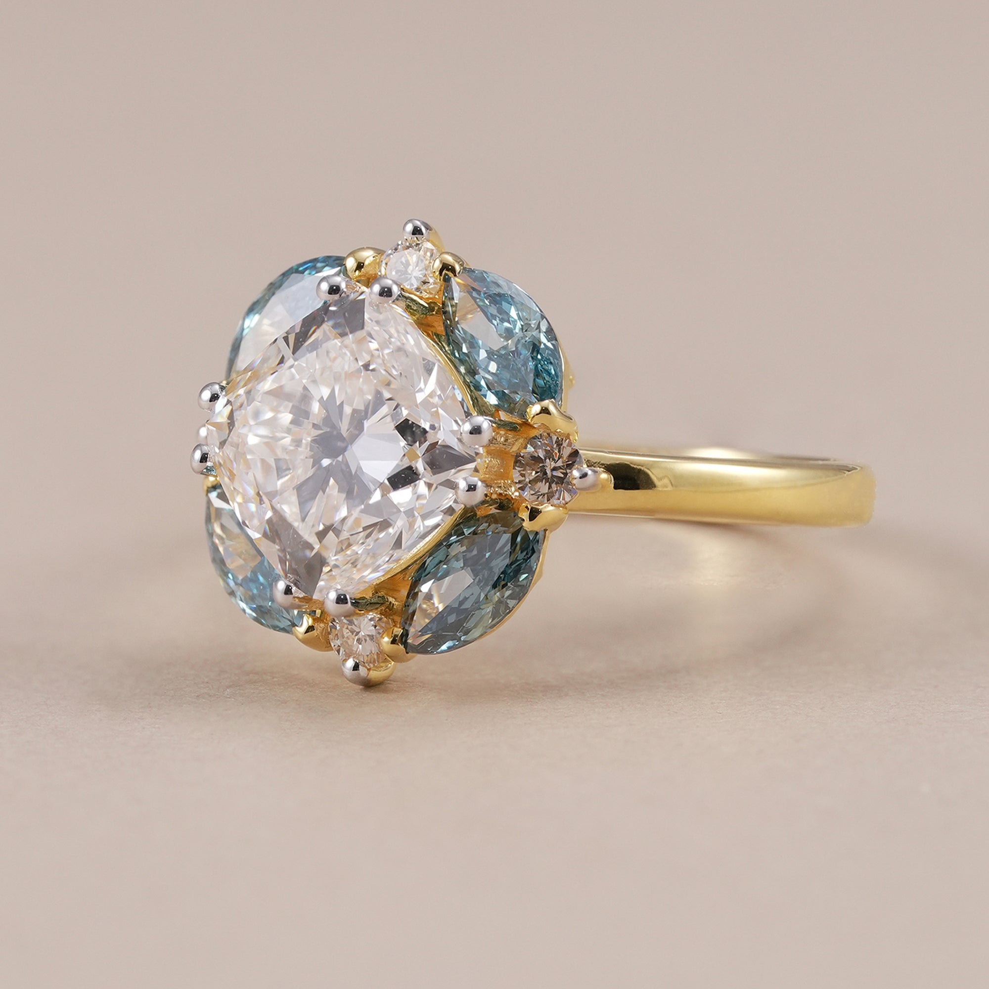 Nature inspired lab grown diamond ring with blue marquise accents