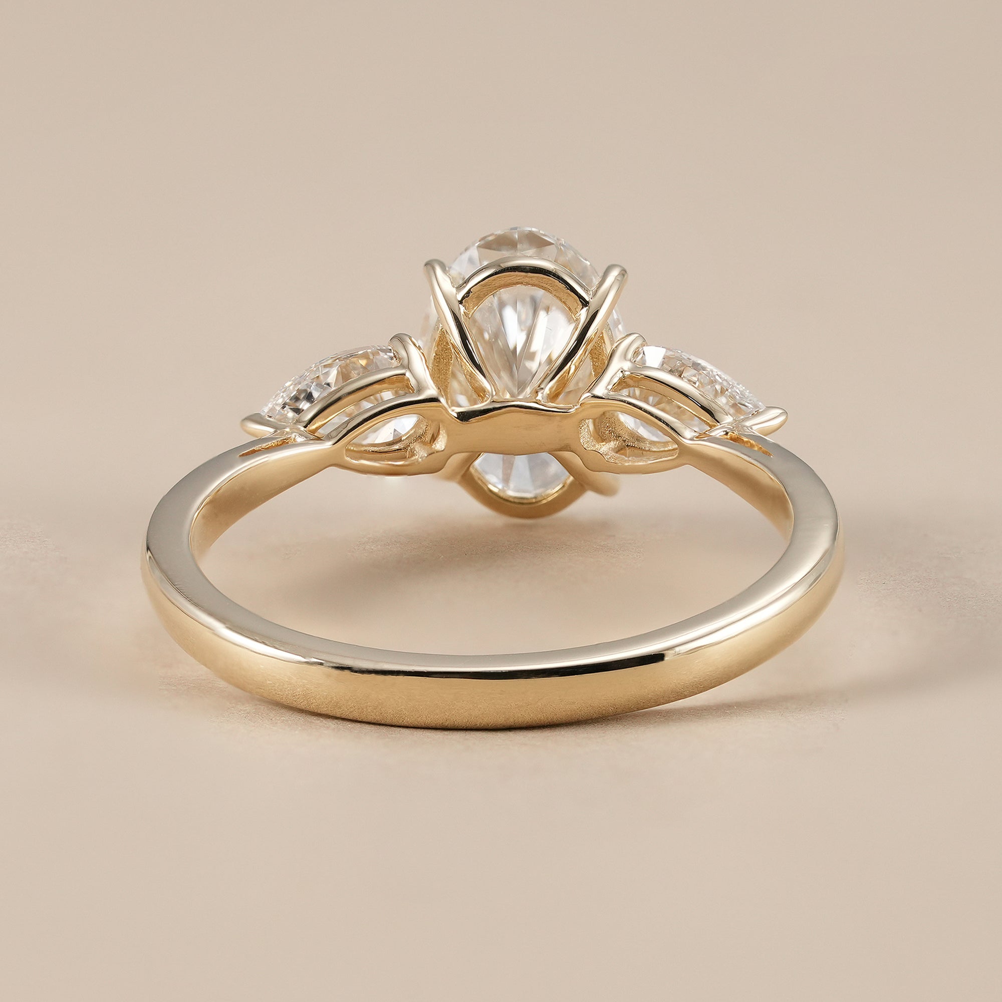 Luxury oval diamond bridal ring with pear side diamonds