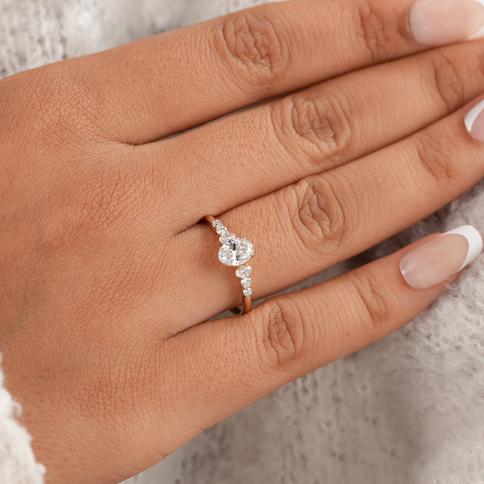 Minimalist oval wedding ring with brilliant side diamonds