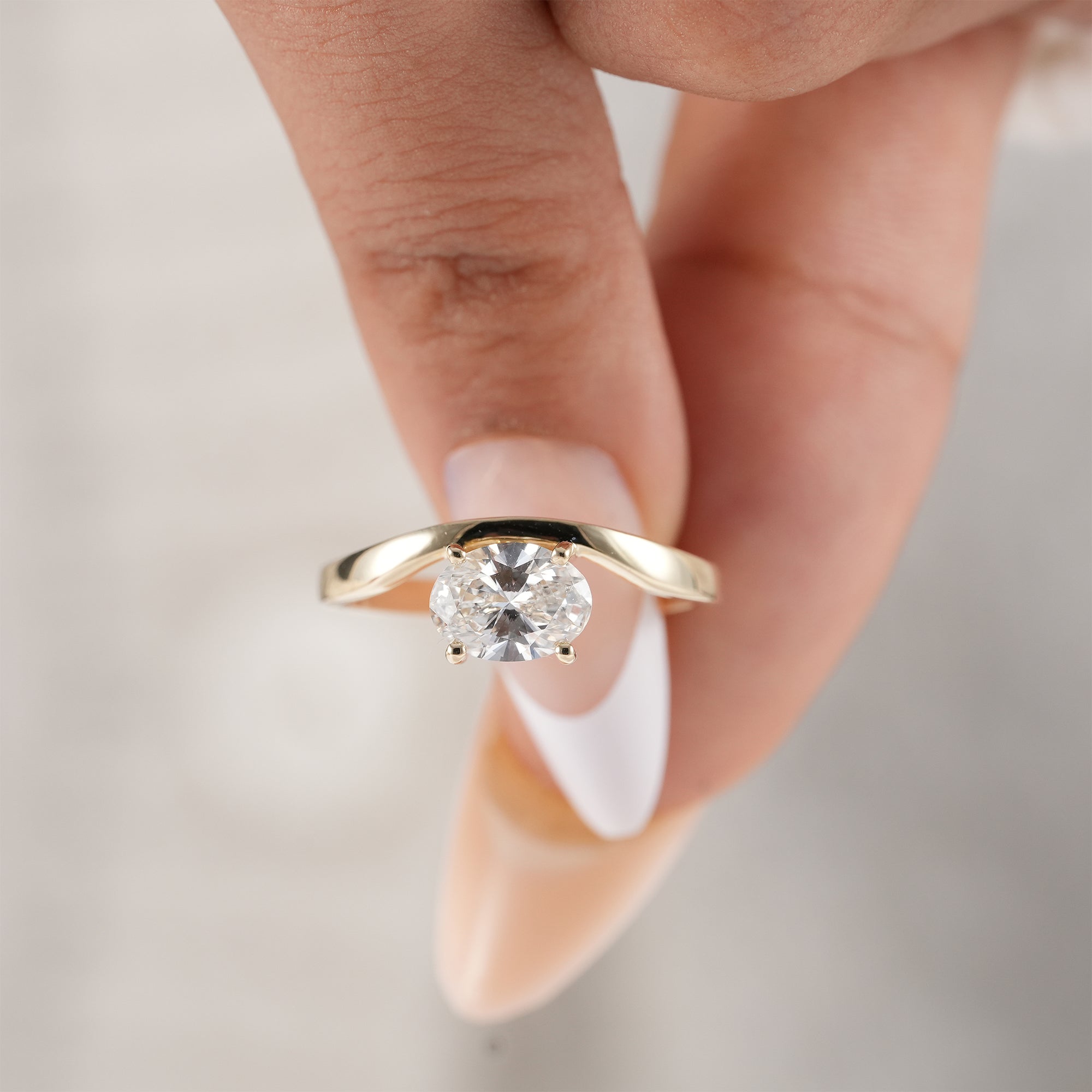 Sustainable lab grown oval diamond proposal ring.