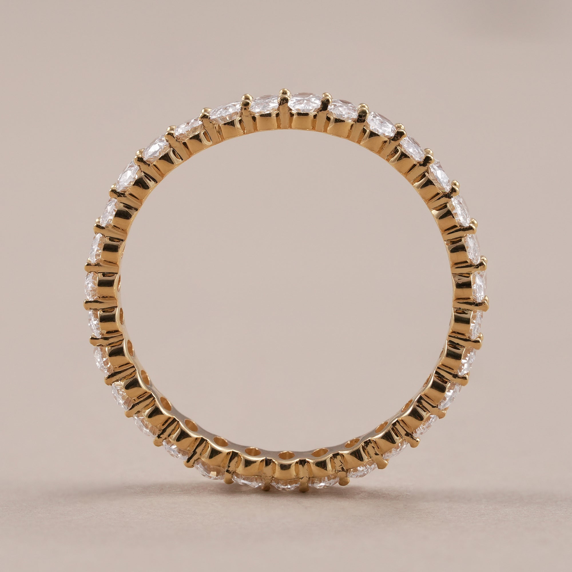 Full eternity ring featuring oval lab grown diamonds.