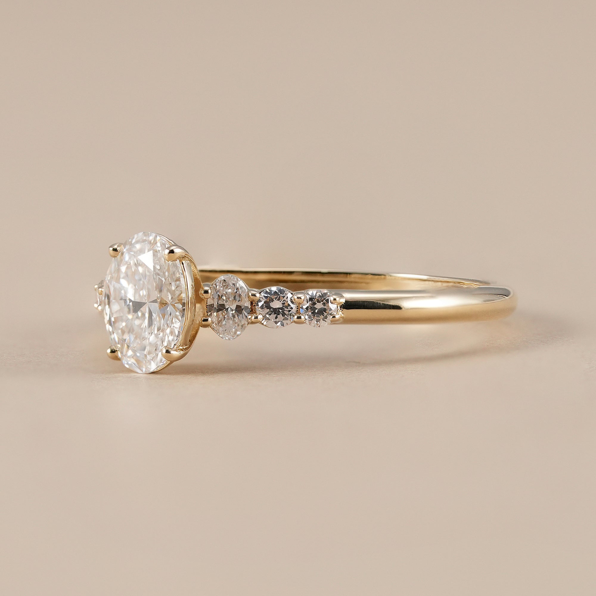IGI certified oval diamond ring with round accent diamonds