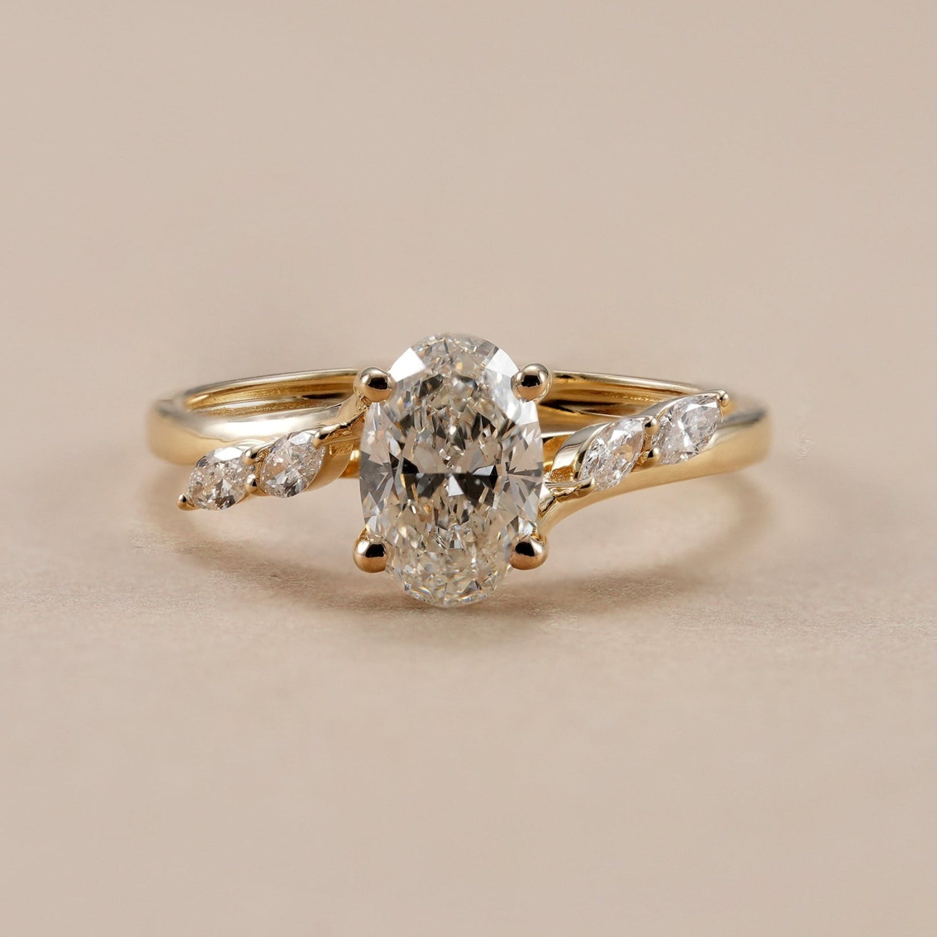 Oval diamond engagement ring with IGI certified lab grown diamond and marquise accents.