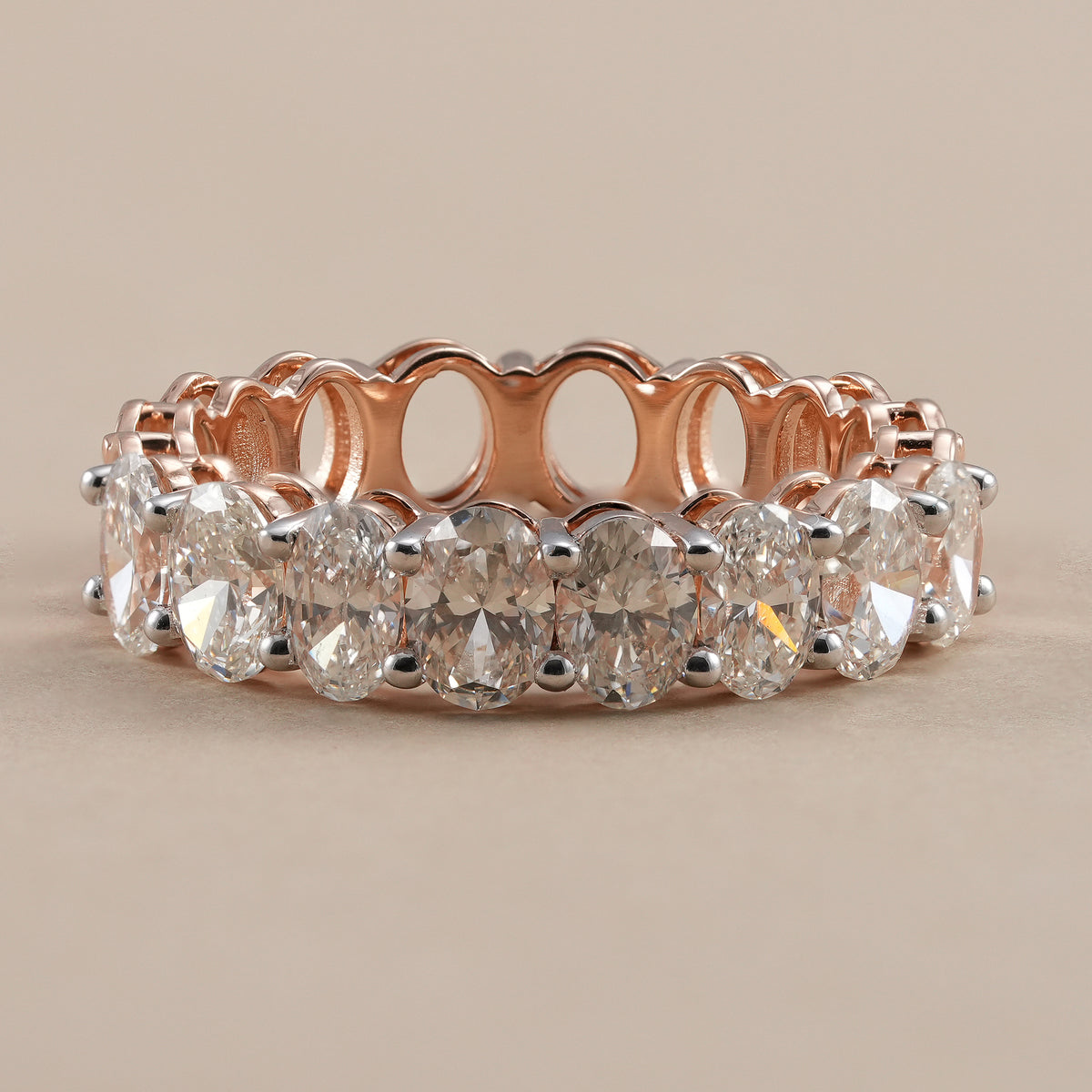 Oval lab grown diamond eternity band in rose gold.