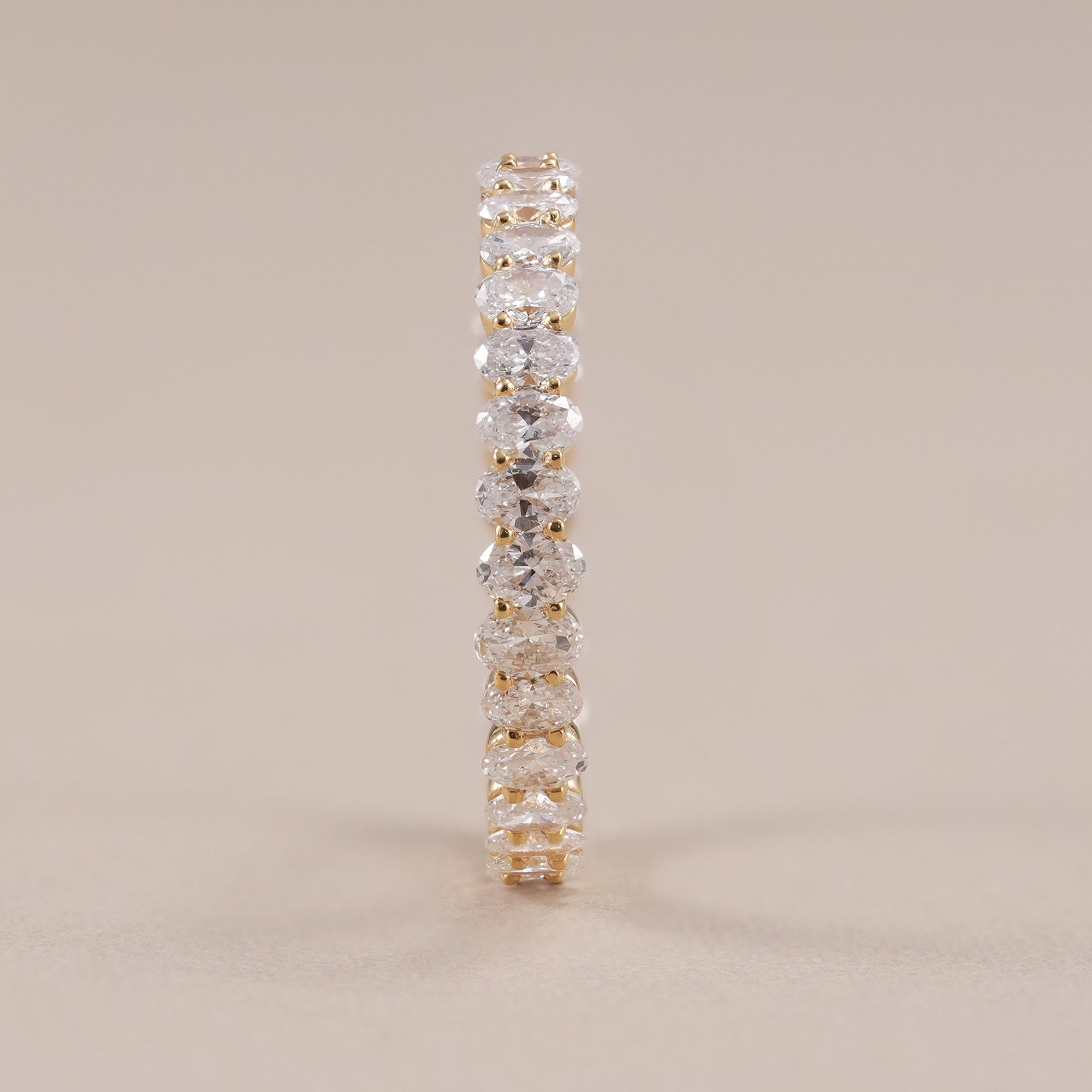 Elegant oval diamond eternity band with shared prong setting.
