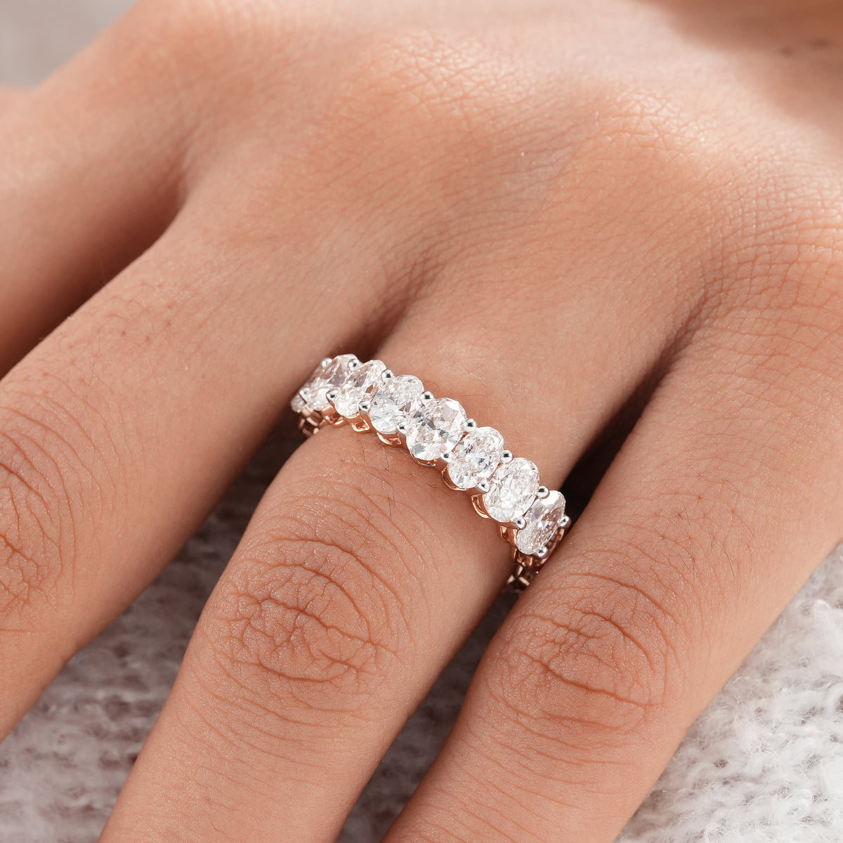 Oval lab grown diamond ring with brilliant sparkle.