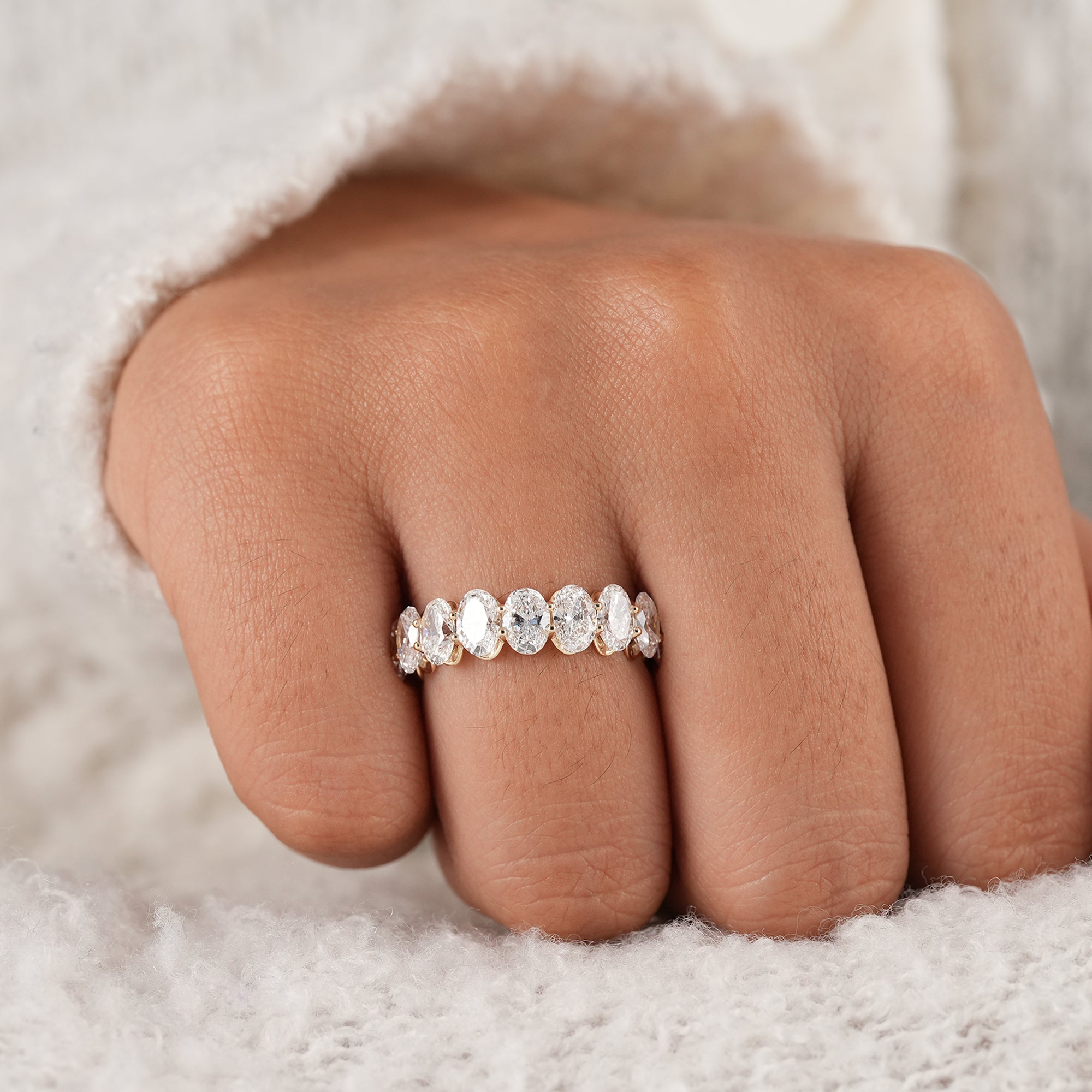 Minimalist oval half eternity ring in solid gold