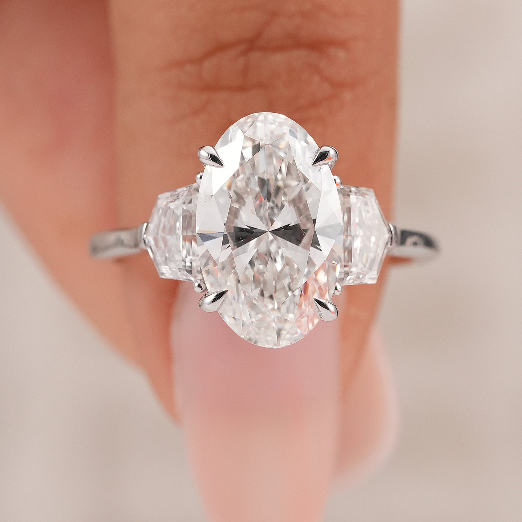 IGI certified oval diamond trilogy engagement ring in white gold