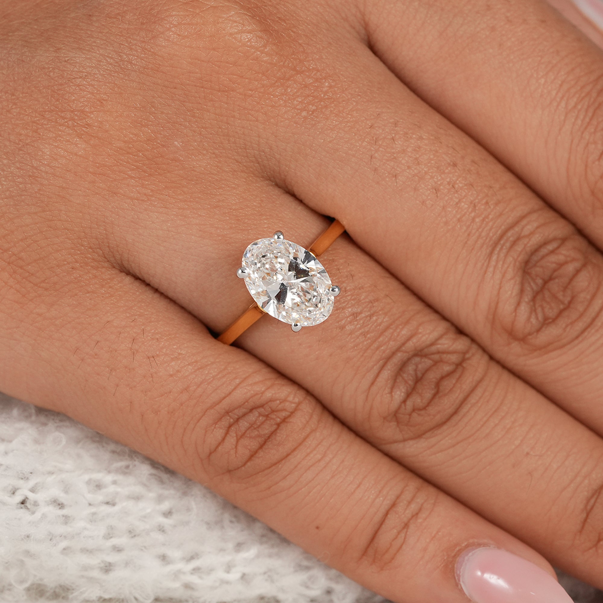 Minimalist oval engagement ring with brilliant lab diamond