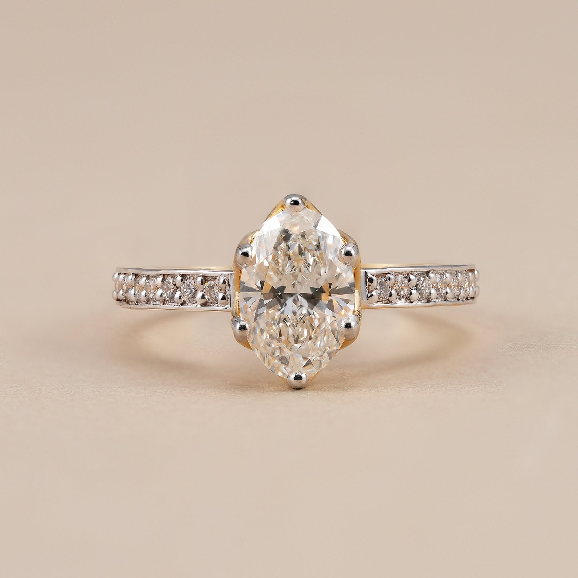 Oval lab grown diamond engagement ring with pavé diamond band