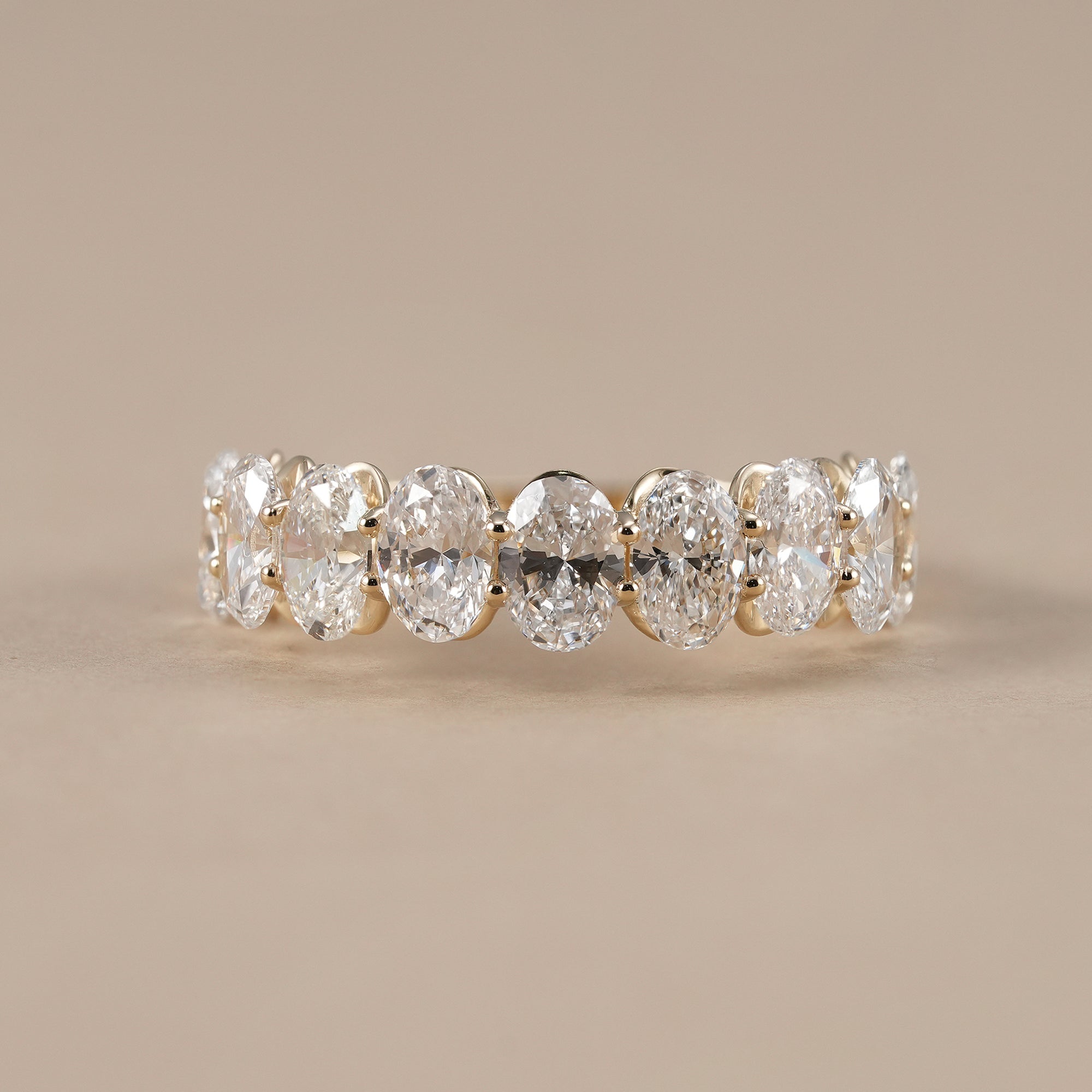 Oval half eternity lab grown diamond ring in yellow gold