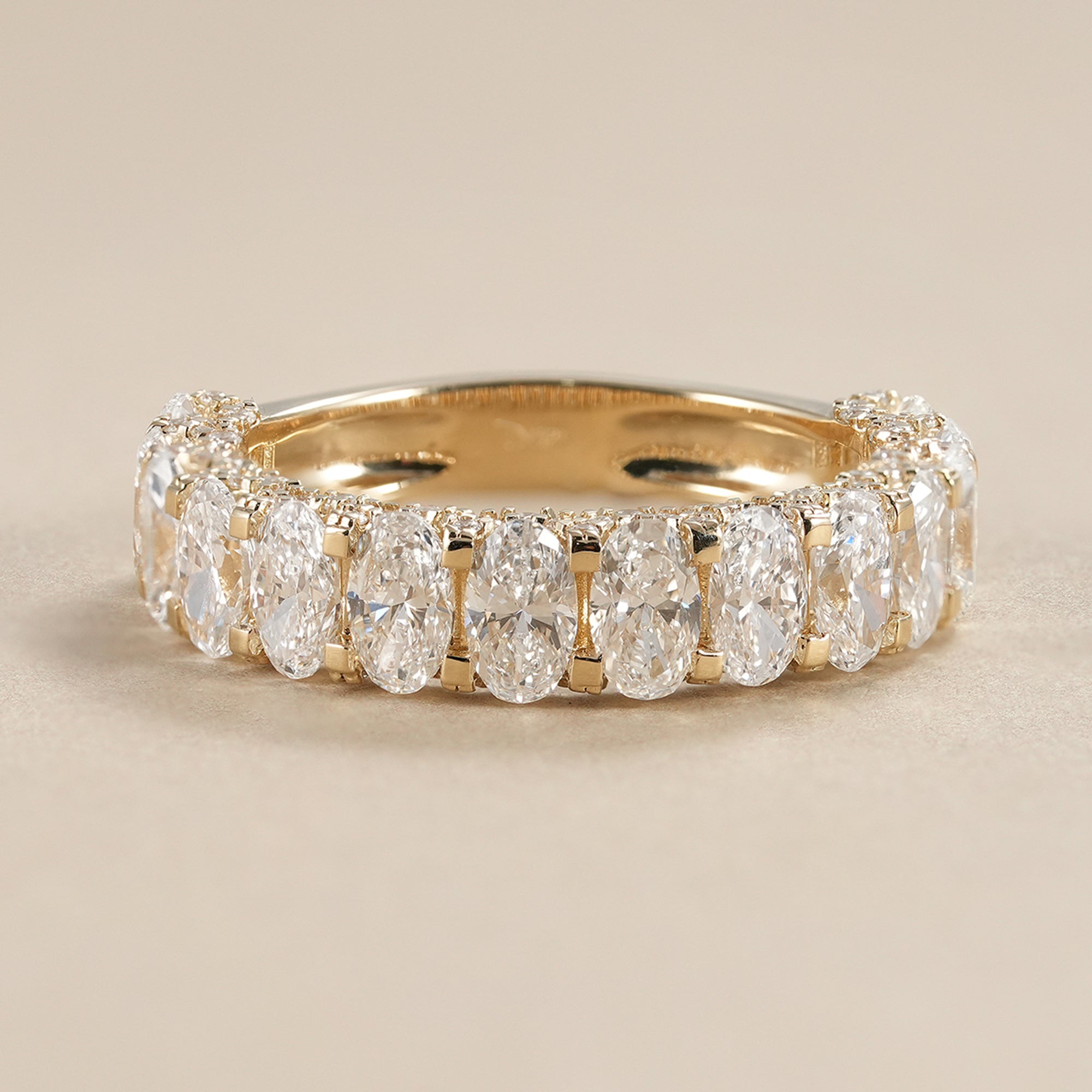 Oval lab diamond eternity band featuring IGI certified diamonds in a full eternity wedding band design.