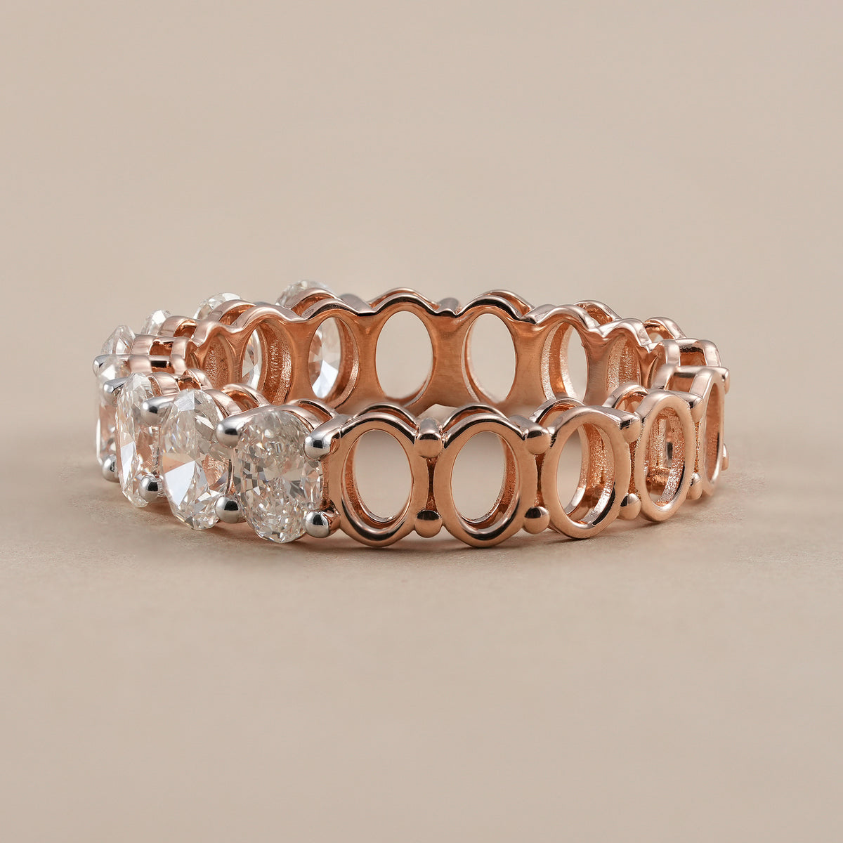 Stackable oval diamond band handcrafted in rose gold.
