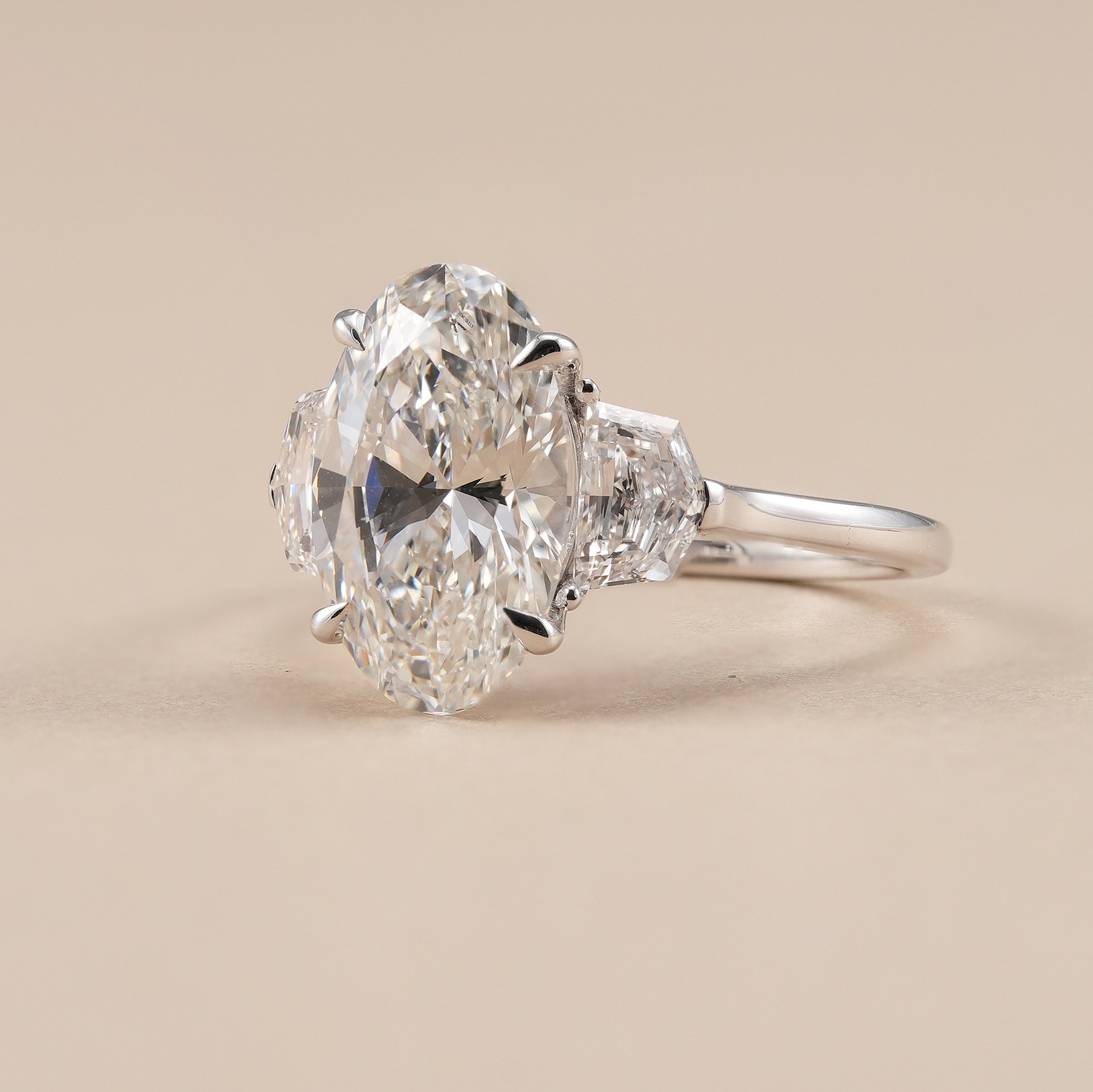 Oval lab diamond bridal ring featuring Cadillac accent diamonds