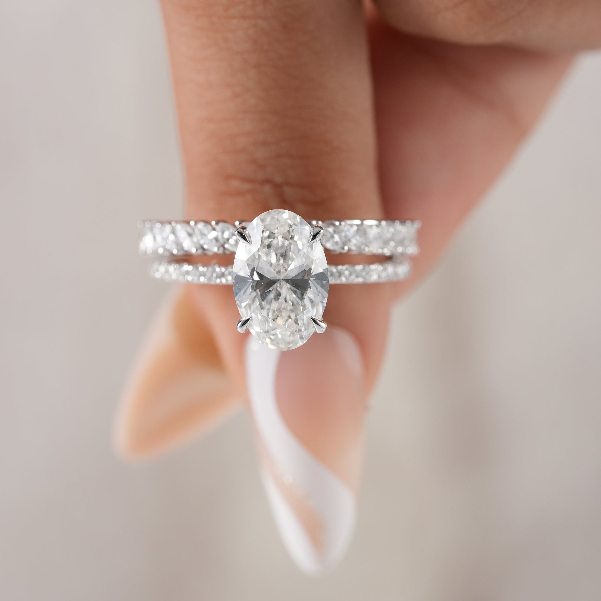 Oval lab diamond proposal ring with marquise stacking ring.