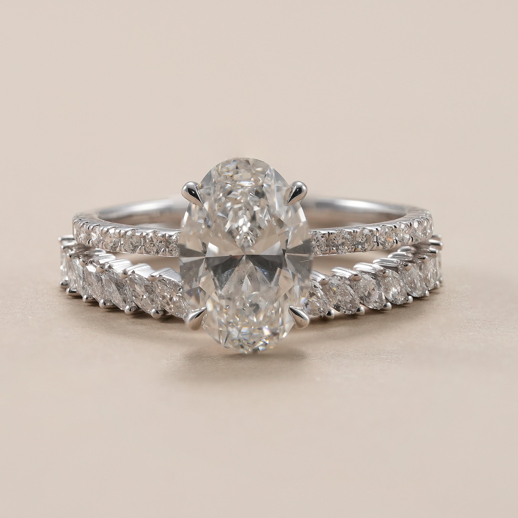 Oval lab diamond ring set with 2 CT oval engagement ring and marquise wedding band.