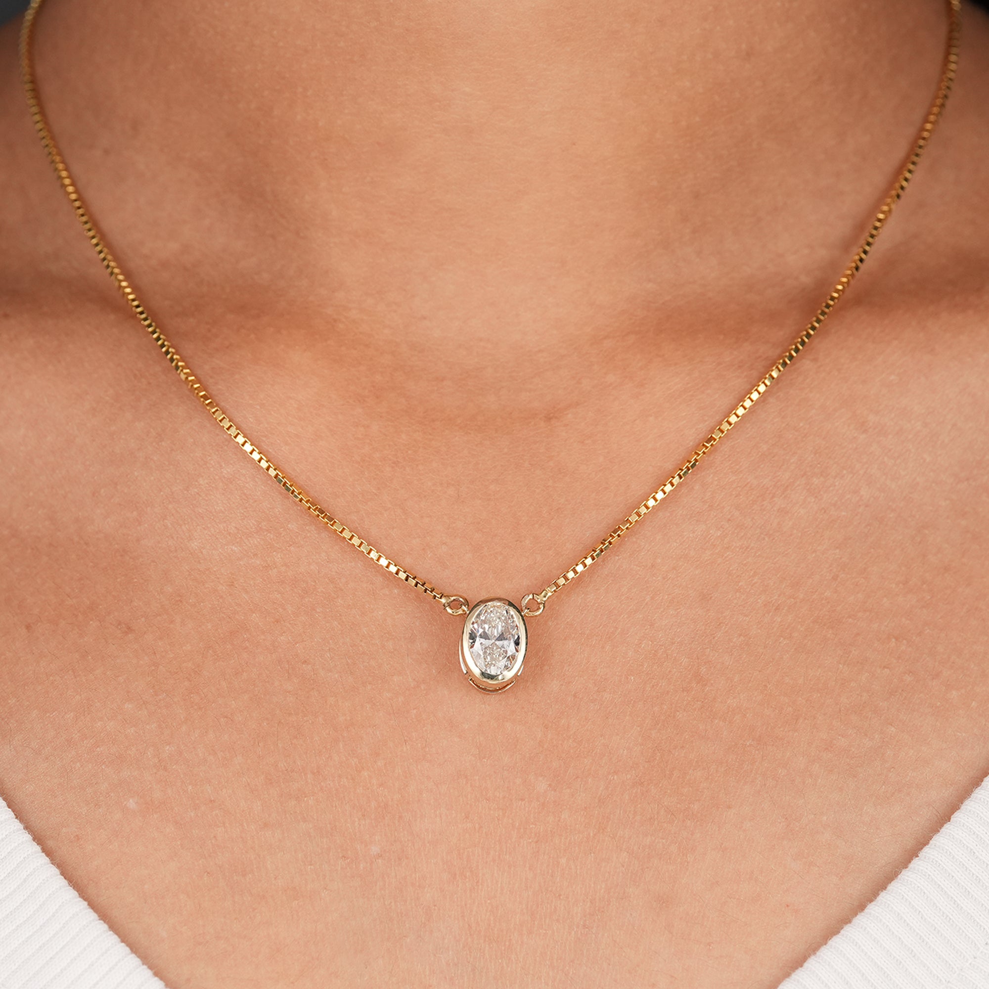 Oval lab grown diamond bezel pendant necklace in solid yellow gold
