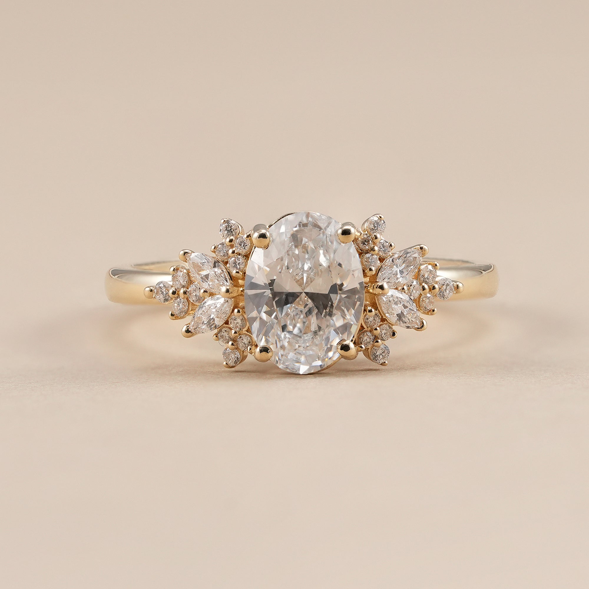 Oval lab grown diamond floral cluster engagement ring with marquise accents