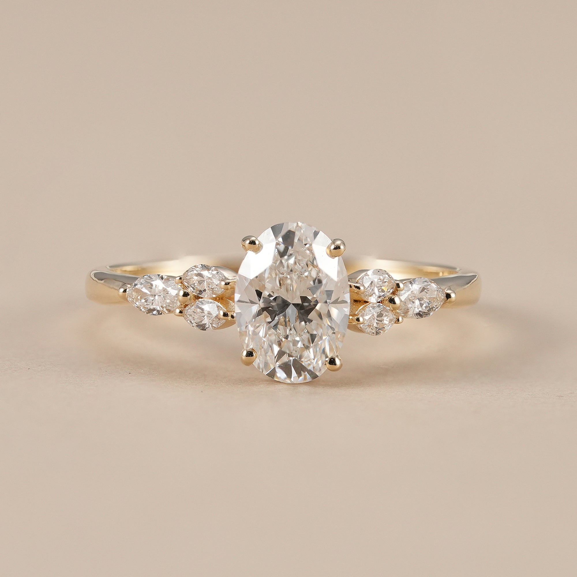 Oval lab grown diamond engagement ring with marquise floral accents